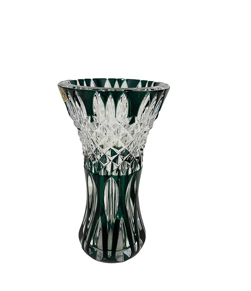 Val Saint Lambert small green cut-to clear Crystal vase, Signed

A Belgium small green colored cut to clear crystal vase from Val Saint Lambert, Belgium, established since 1826. 
The vase is signed on the bottom and the vase has the golden paper