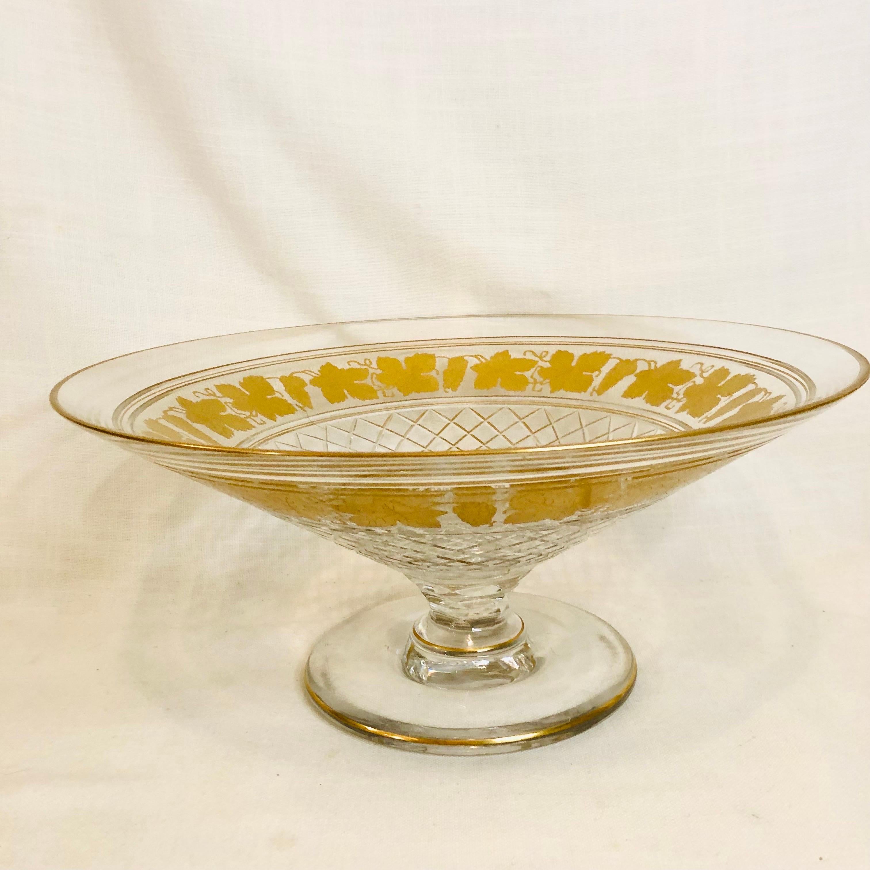 This is an absolutely fabulous and stunning Val Saint Lambert cut crystal center bowl with gilded decoration of grapes and grape leaves. This large bowl is formed on a raised beautifully cut base. This bowl is 13.88 inches in diameter. This would be