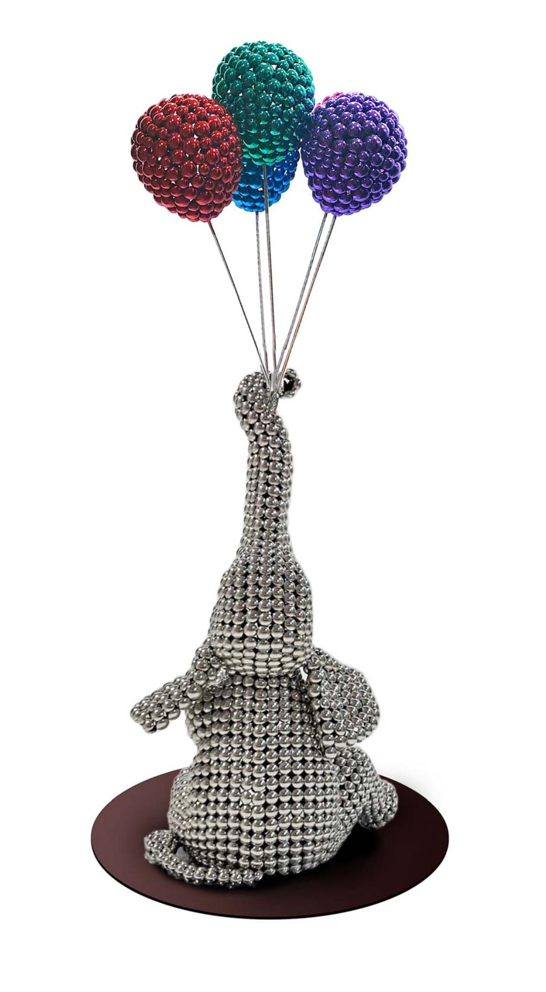 elephant holding balloon
