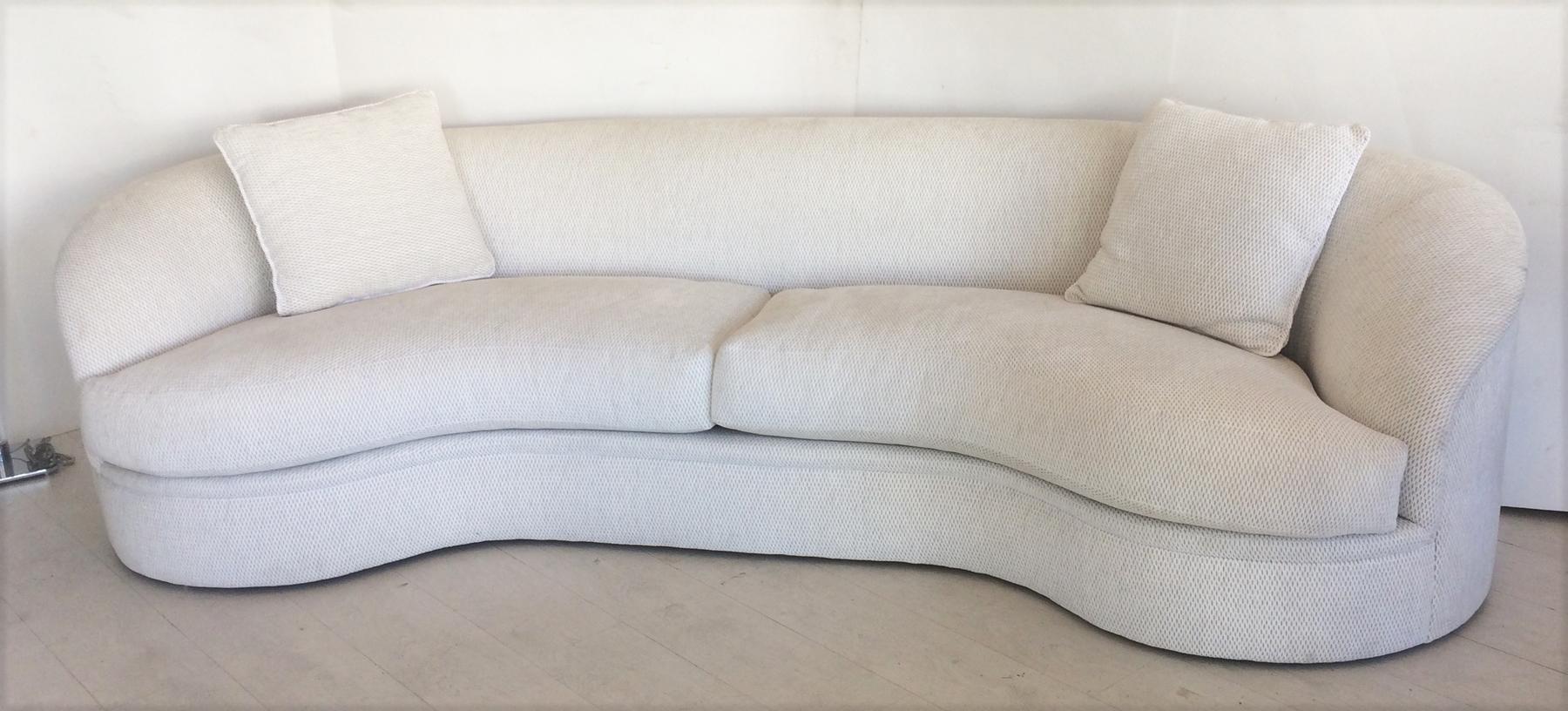 Large curved sofa designed by Kagan for Directional. Very well constructed, heavy comfortable kidney bean shaped sofa comes with two throw pillows. We have two of these sofas both identical. From a very clean estate.