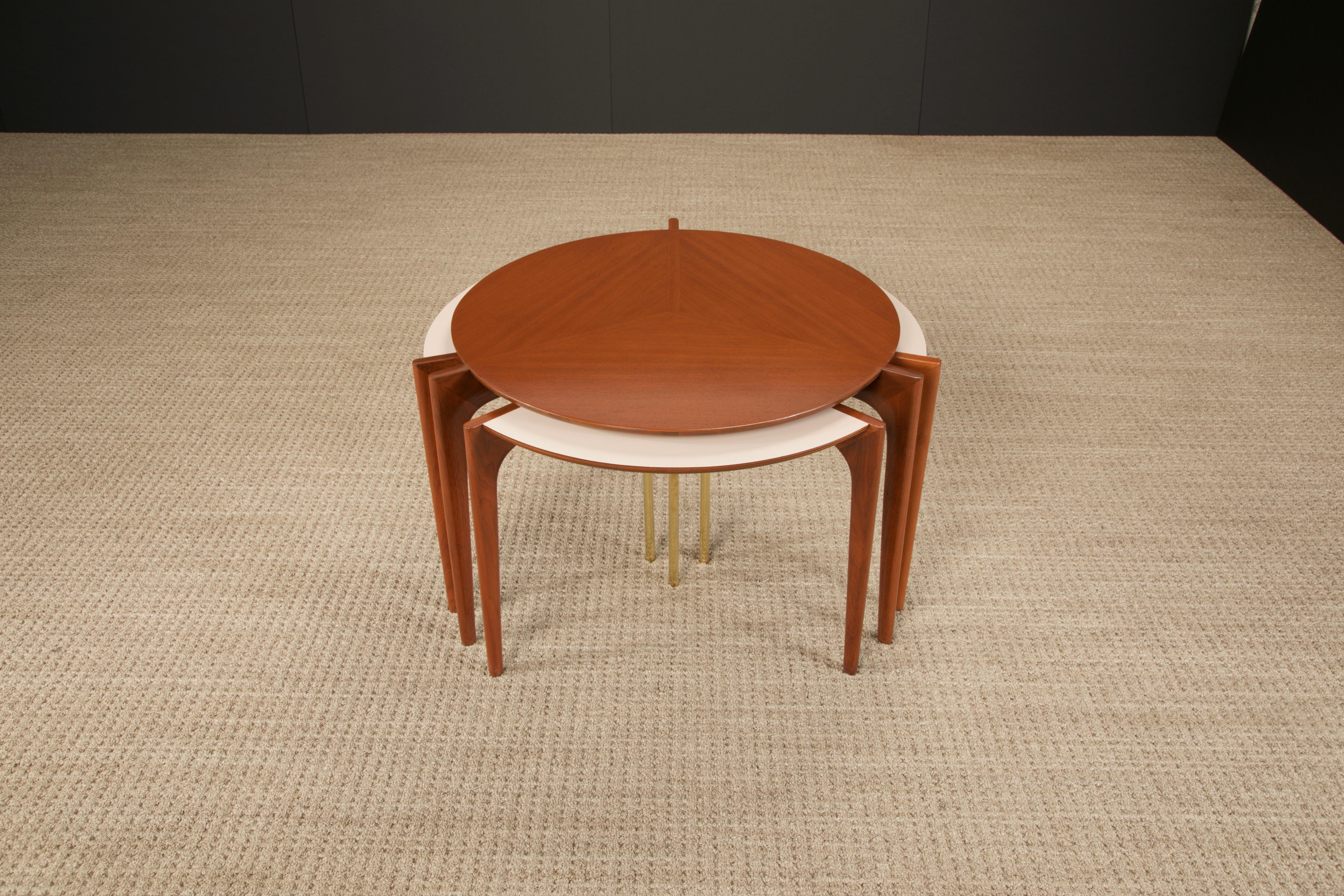An extremely rare collectors set of nesting tables by Vladimir Kagan for Grosfeld House (1950's USA), fully restored. This set is signed underneath the center table with original Grosfeld House sticker label, and documented in early Grosfeld House