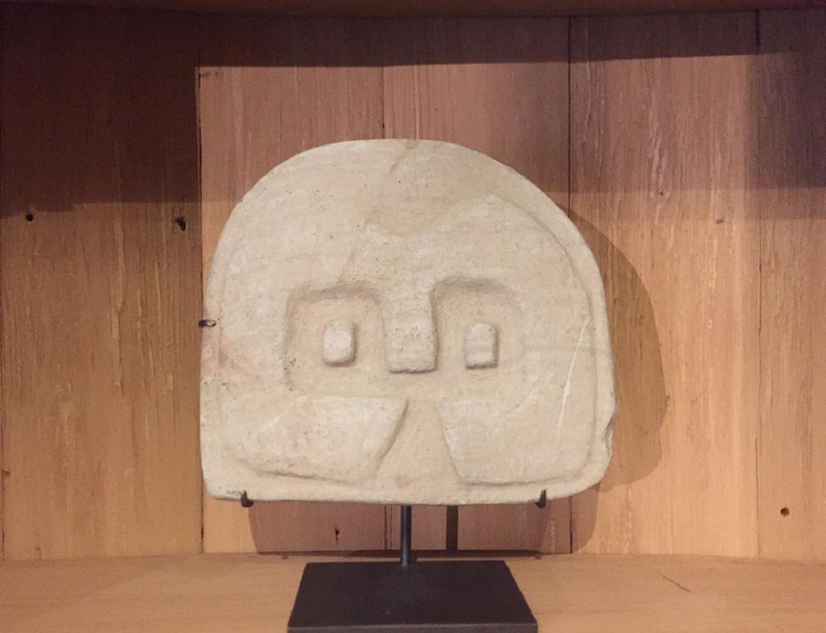 A pre-Colombian (Equador) stele depicting a abstract owl. These sculptures are typical for the Valdivian Early Horizon culture (2300-2000 BCE). This culture is among the oldest of the region and for their sculptures they used a pearly grey stone.