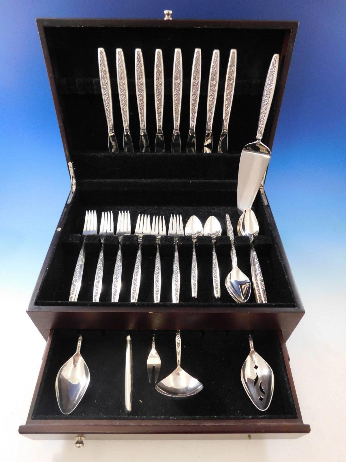 Valencia by International sterling silver flatware set, 46 pieces. The Valencia pattern was introduced in the year 1964 and features a contemporary shaped handle with an all-over decorative floral and leaf pattern on the front. This set