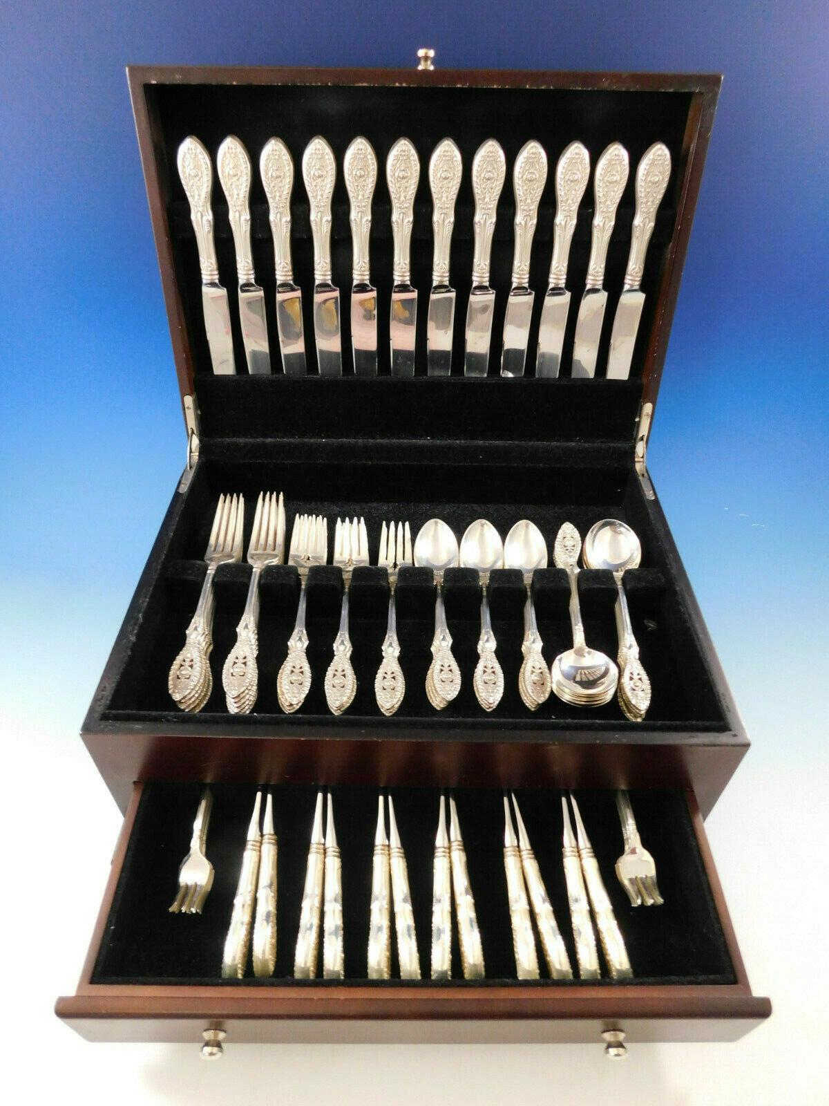 Valenciennes by Manchester sterling silver Flatware set with unique pierced handle with floral motif - 84 pieces. This set includes:

12 knives, french blade, 8 3/4