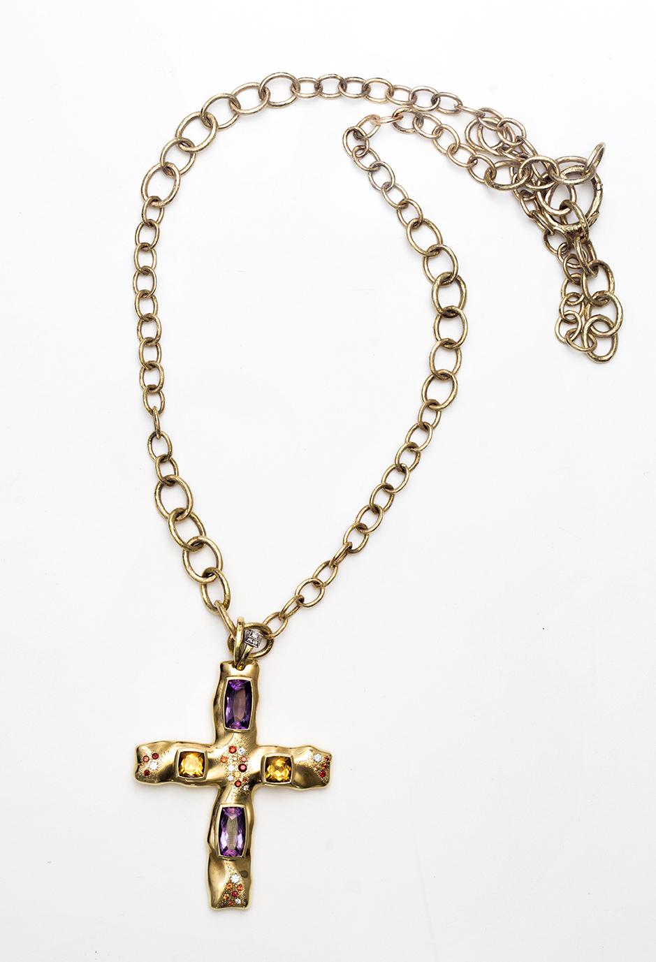 An 18 Karat Yellow Gold Cross Featuring 2 Citrines 1.26 x 0.67 cm each and 2 Amethysts 0.64 x 6.40 cm each, Orange, Red Sapphires and Diamonds on a 18 Karat Yellow Gold Link Chain of 160 Centimeter Length. The Cross can be easily removed from the