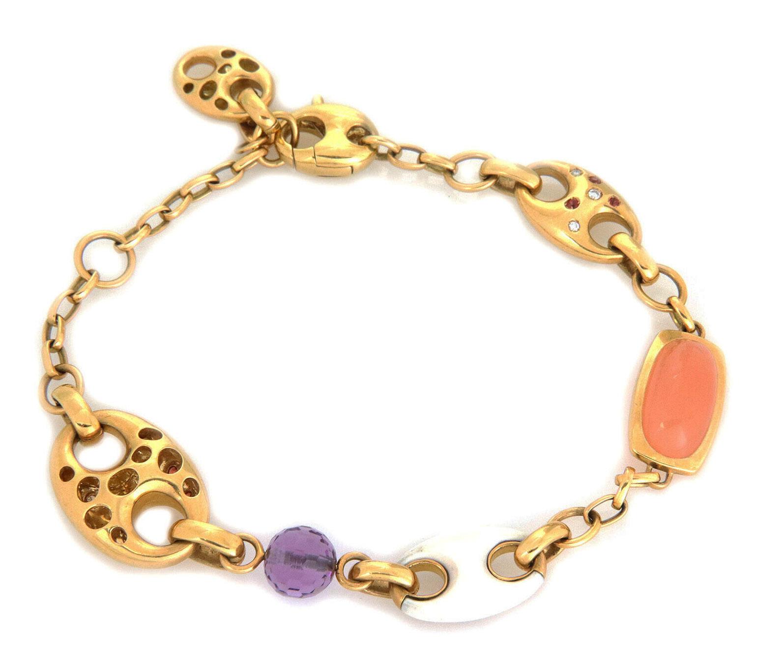 This elegant authentic bracelet is by designer Valente, it is crafted from 18k yellow gold with a polished finish featuring large and small mariner link motifs decorated with flush set citrine and diamonds with small oval chain links, one small