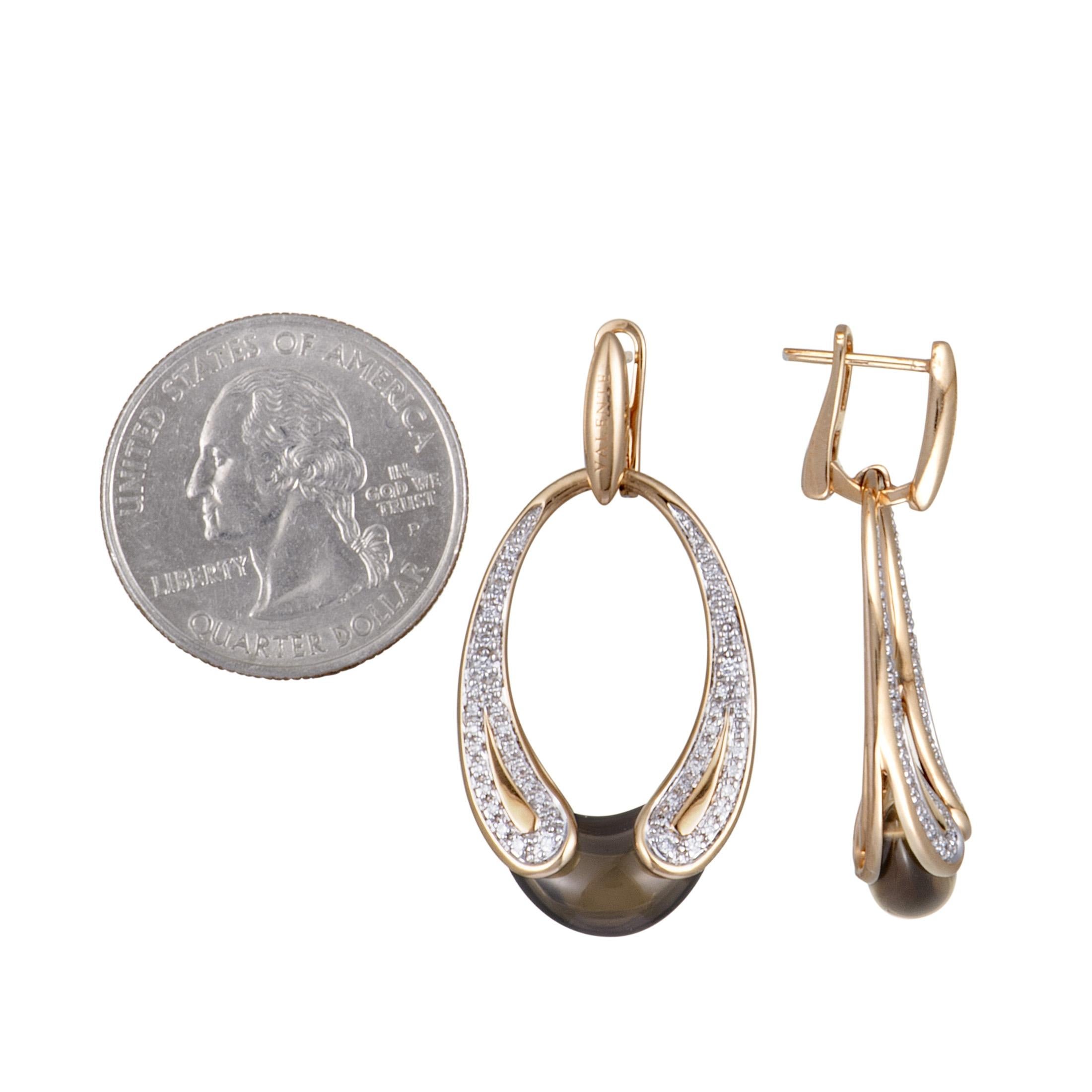 Boasting a splendidly elegant design that is beautifully topped off with a classy blend of lustrous white diamonds and sublime smoky quartz, these exceptional earrings offer a wonderfully refined appearance. Presented by Valente, the pair is made of