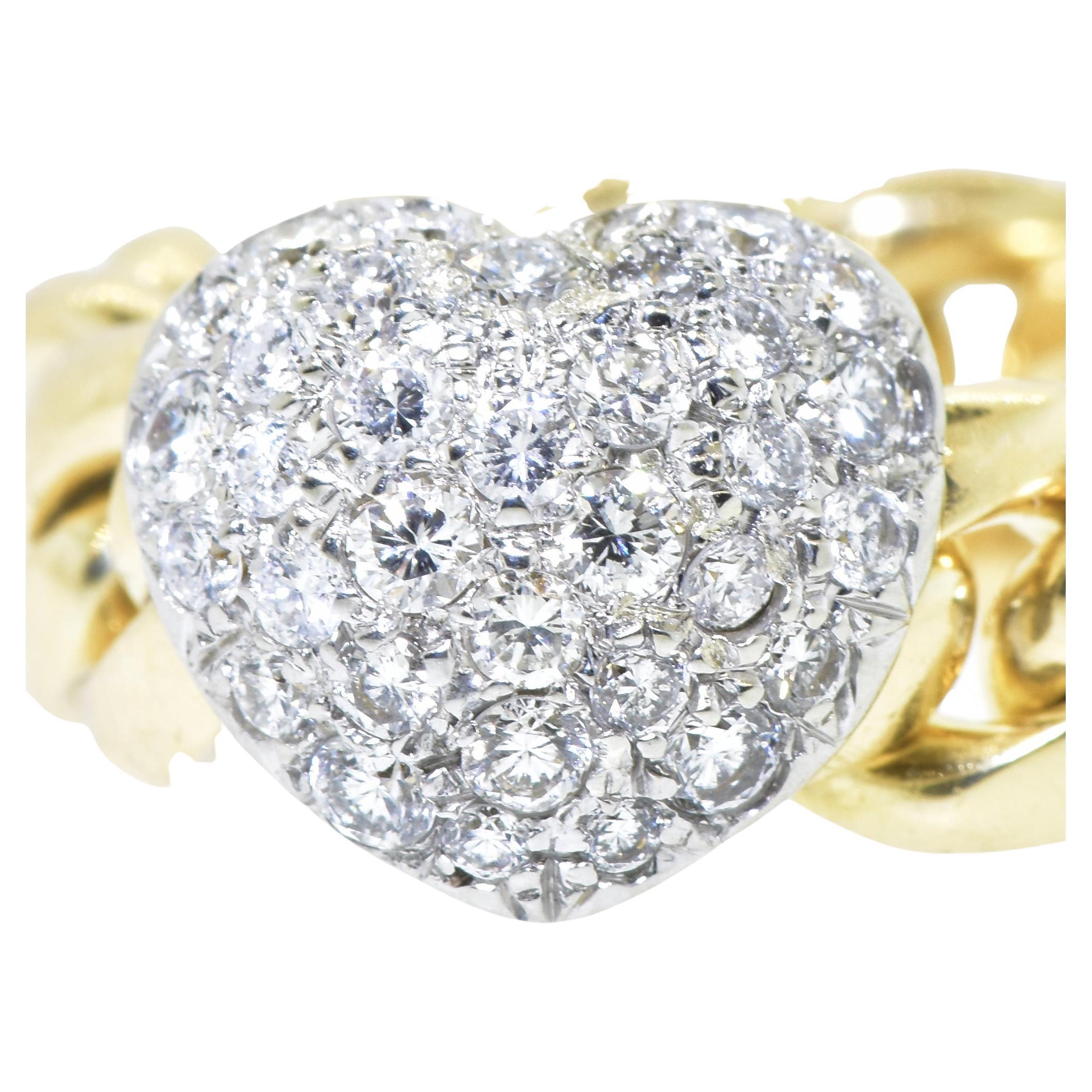 Valente Platinum and 18K yellow gold heart motif unusual ring.  The platinum and diamond pave heart slides along the flexible 18K gold link.  The diamonds are quite nice. Brilliant cut, all well matched and finely cut.  The diamonds set in platinum