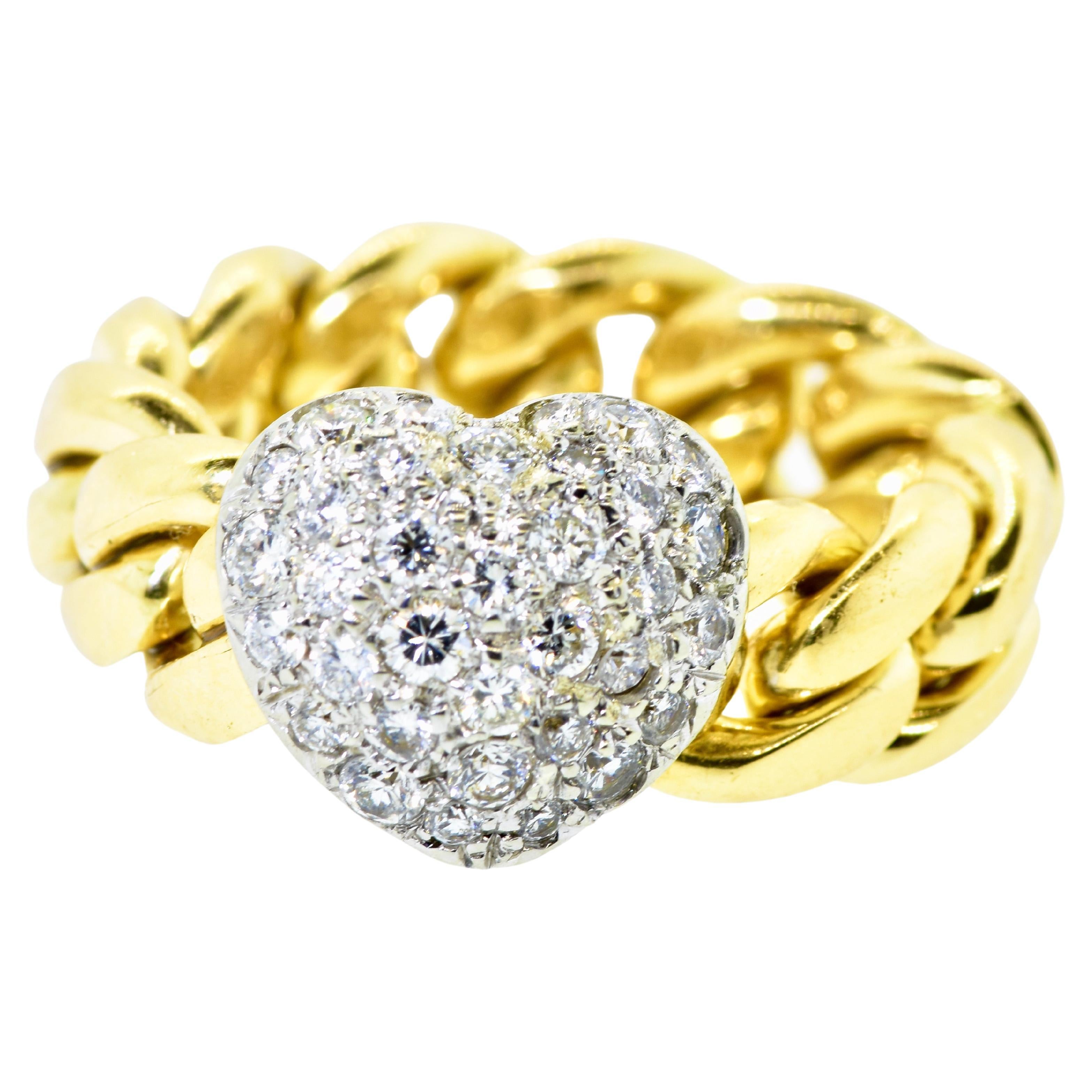 Valente Platinum and 18K yellow gold heart motif unusual ring.  The platinum and diamond pave heart slides along the flexible 18K gold link.  The diamonds are quite nice. Brilliant cut, all well matched and finely cut.  The diamonds set in platinum