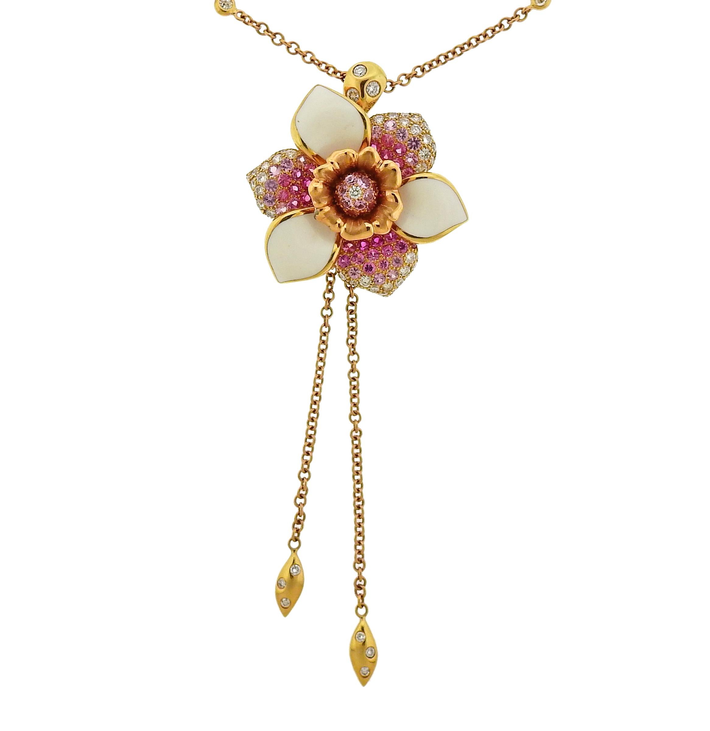Valente flower pendant necklace in 18k gold, featuring approx. 1.67ctw in G/VS diamonds, enamel petals and approx. 2.80ctw in pink sapphires. Necklace is 17.5