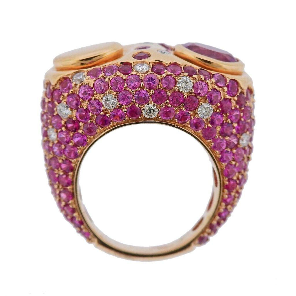 18k gold Ring crafted by Valente. Ring features 0.73ctw in VS G diamonds, and pink sapphires. Ring size - 6.75, ring top is 16.5mm wide. Total weight 17.4 grams. Marked Valente.


