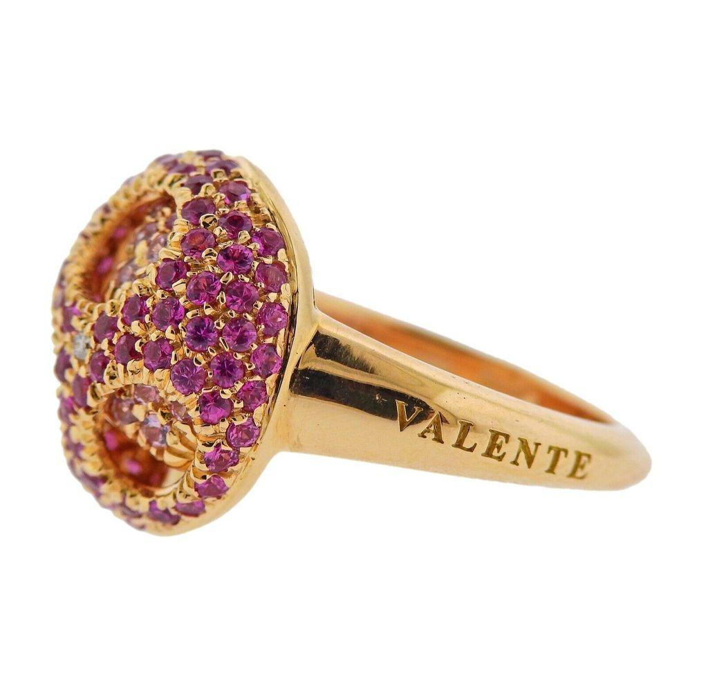 18k gold ring crafted by Valente. Ring features 0.02ctw in VS GH diamonds, and 1.73ctw in pink sapphires. Ring size - 7.25, ring top - 17mm in diameter. Total weight 11.6 grams. Marked Valente, Italian mark, 750.

