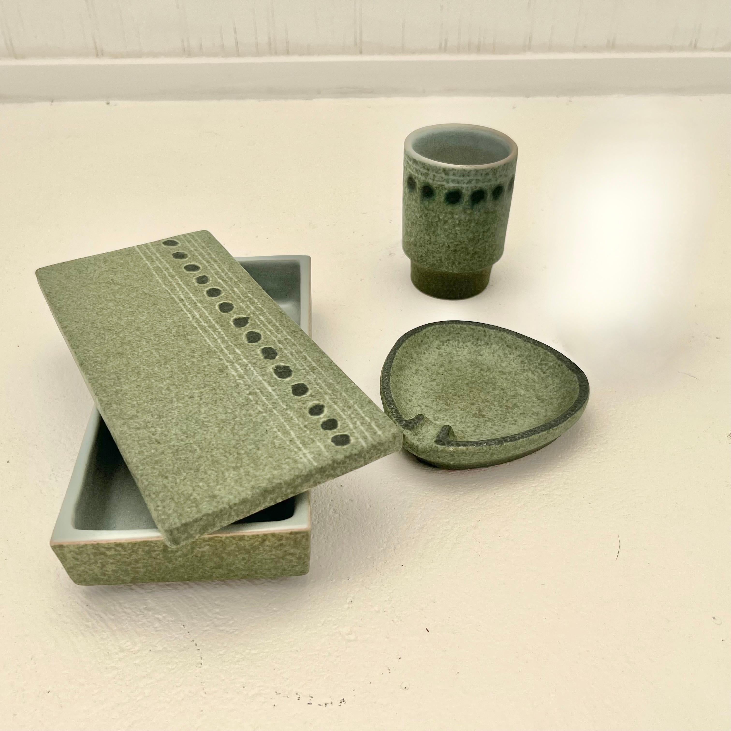 Stunning set of Valenti ceramics including an ashtray, box and a small cup. Made in Italy during the late 1980s as shown on the branded markings of the base. This rare set is in a unique hand painted mint green with dark green accent dots. Perfect