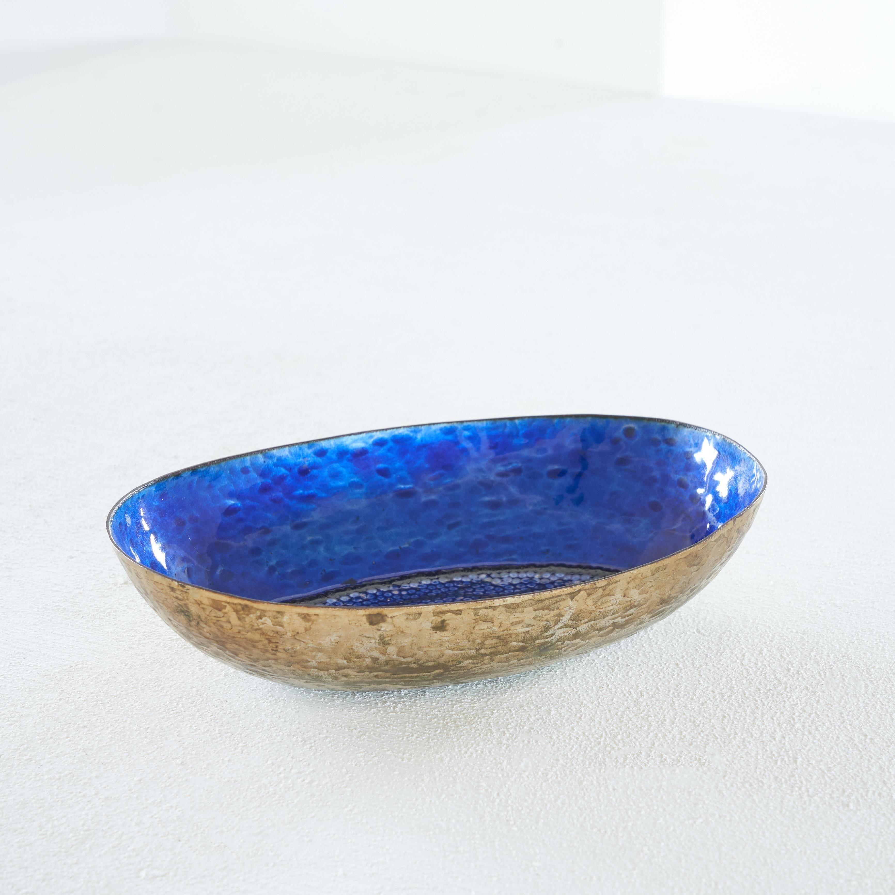 Valenti hand hammered and enameled bowl, Padova, Italy, 1960s.

A mesmerizing enamel bowl by Valenti from the city of Padova (Padua) in Italy. It is a wonderfully thin and delicate enameled copper bowl in blue. The enamel has beautiful tones of blue