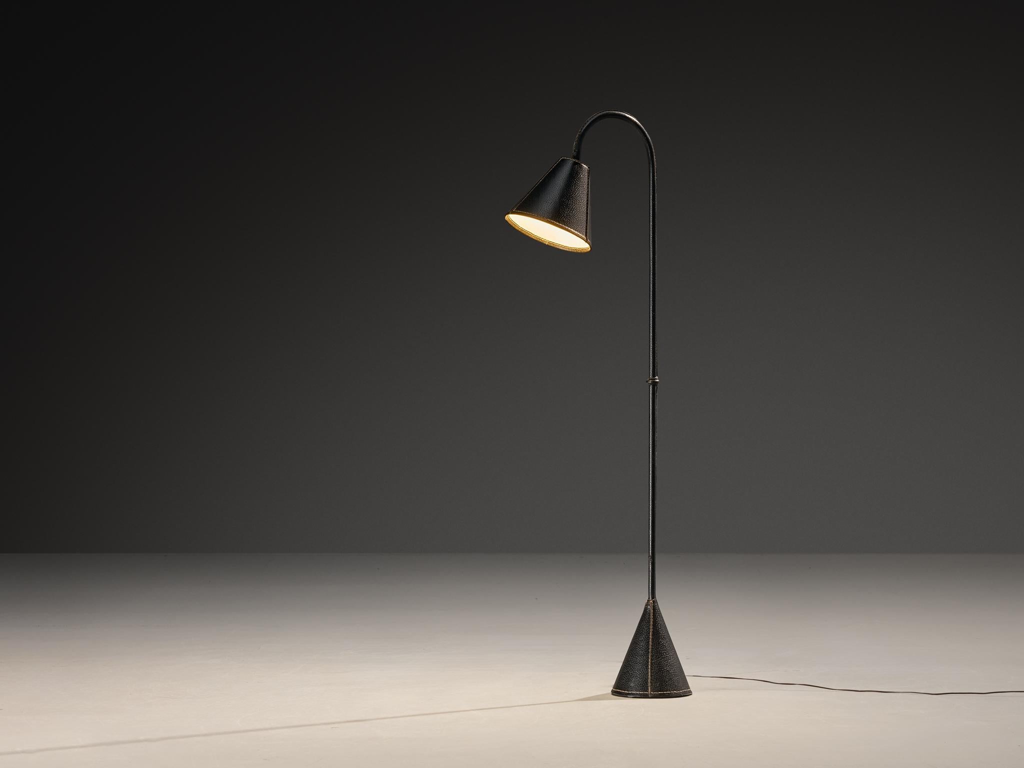 Valentí, floor lamp, saddle leather, iron, Barcelona, Spain, 1970s

Quietly understated yet assertive floor lamp by Spanish company Valentí. Its stark geometry speaks volumes. A single, uninterrupted curve arcs from the base to the light source,