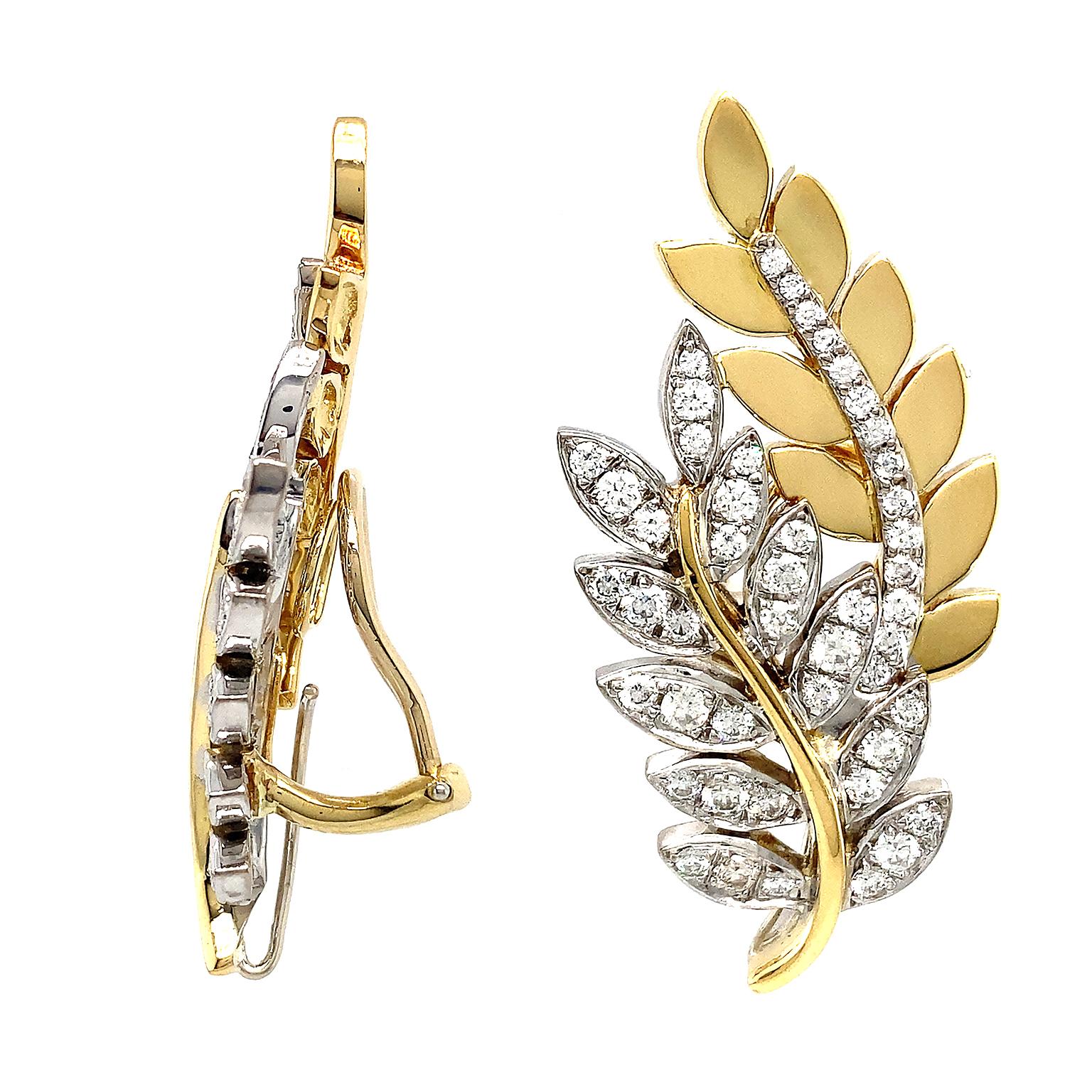 Diamonds and gold give life to the motif of Olympia leaves for these earrings. 18k yellow gold forms the leaves of the bough in the back. Brilliant cut diamonds set in palladium glimmer as the midrib. The front bough has brilliant cut diamond leaves
