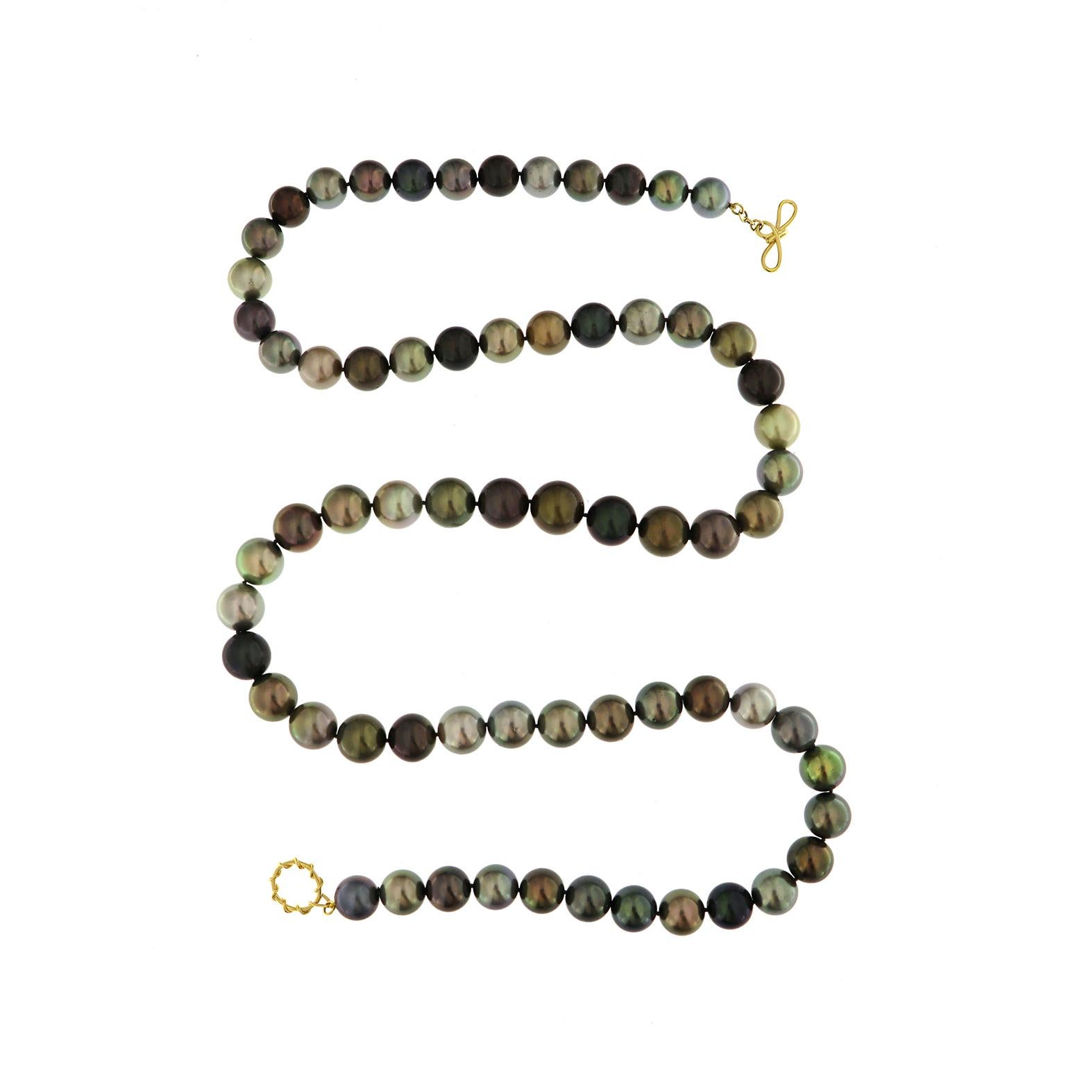 Valentin Magro 18 Karat Yellow Gold Pearl Necklace showcases shades of grey. Sixty-six pearls, 14mm by 12mm each, fill the strand. While they match in hue, shape, and luster, their colors show great variety. Some are lighter and other darker.