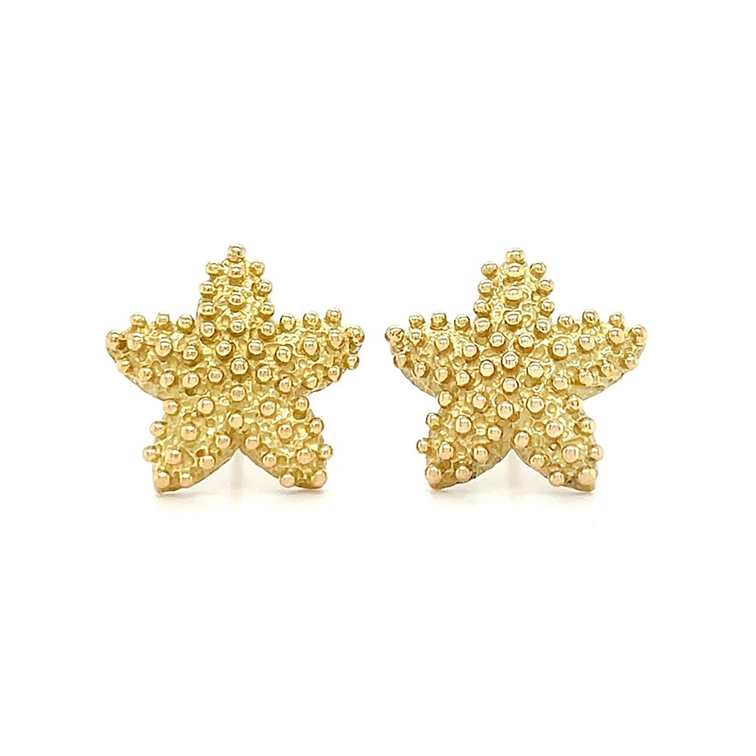 Gold depicts an oceanic animal for these earrings. 18k yellow gold is given texture for a realistic base, while the skin is embellished by small sleek orbs of the metal. Friction backs fasten the earrings, which measure 0.57 inches (width) by 0.57