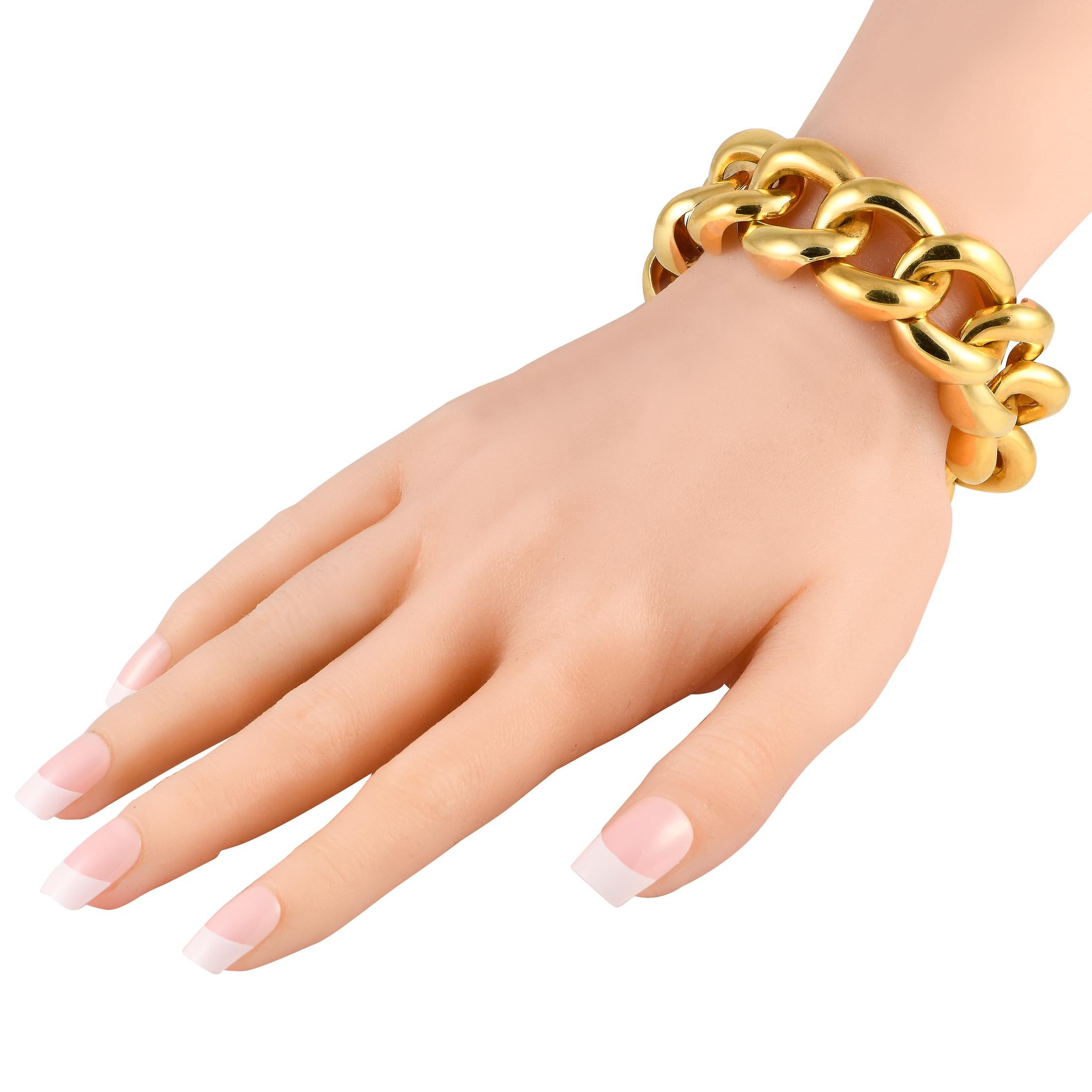 This weighty and extra-chunky chain link bracelet in solid 18K yellow gold delivers its style statement with an unshakeable sense of confidence. It measures 8 long and has a secure hidden clasp. Each link comes with a smooth and glossy polished