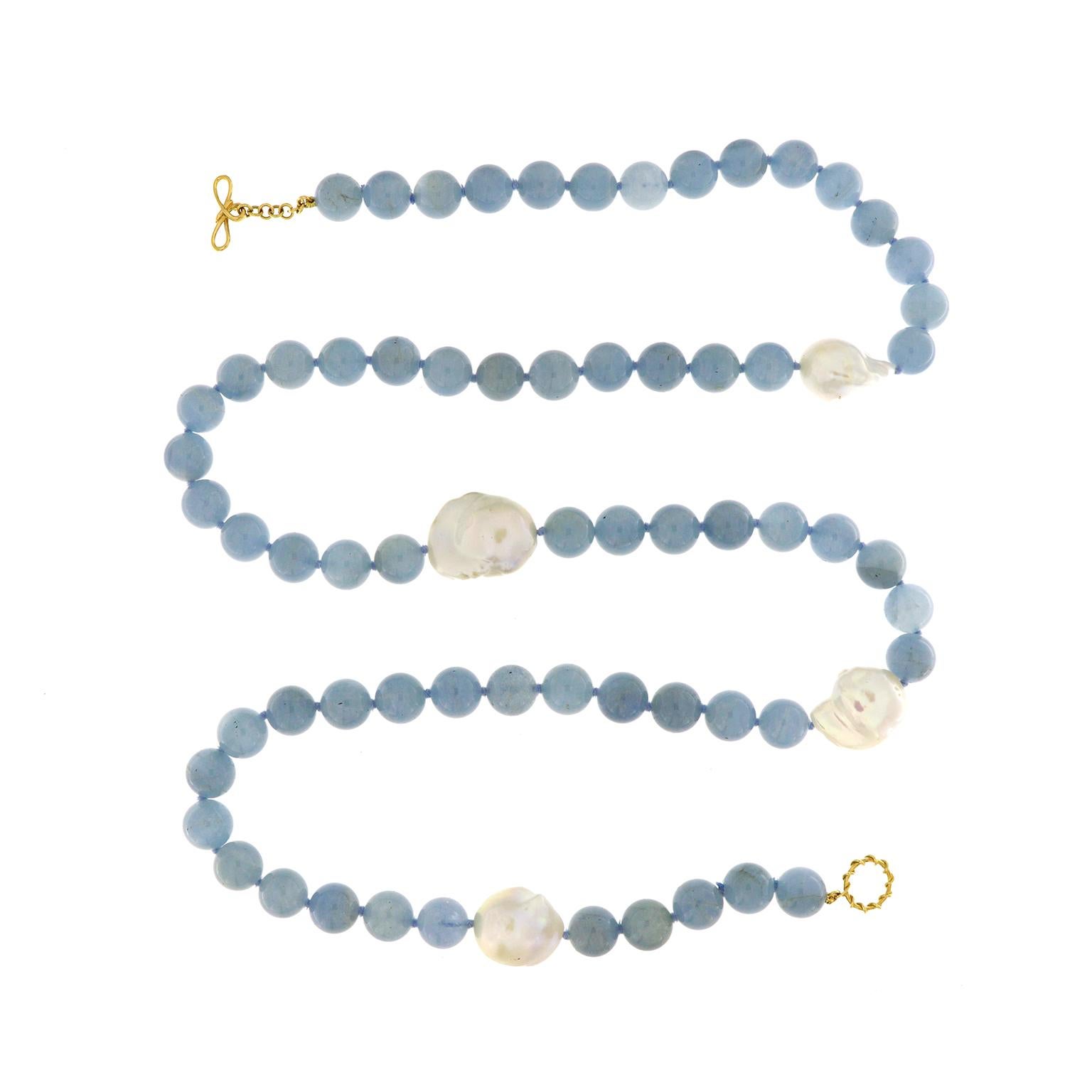 Valentin Magro Aquamarine Bead Necklace with Fresh Water Pearls place treasures into the ocean. Aquamarine and pearls create this striking necklace. Much of the design consists of sixty five 12mm aquamarine beads. Slight variations in color add