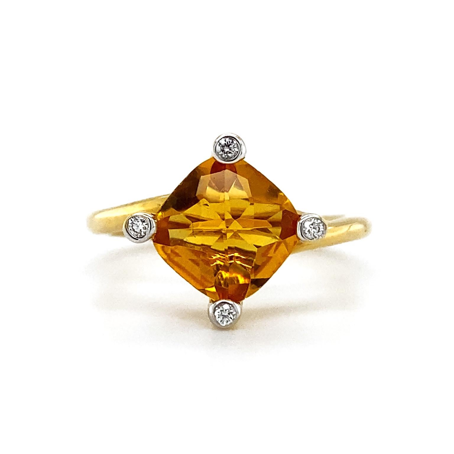 A lustrous cushion cut citrine is heightened with four bezel set brilliant cut diamonds on each corner. An 18k yellow gold band is oblique as the finishing touch. The weight of the citrine is 1.84 carats and the diamonds weigh a total of .04 carats.