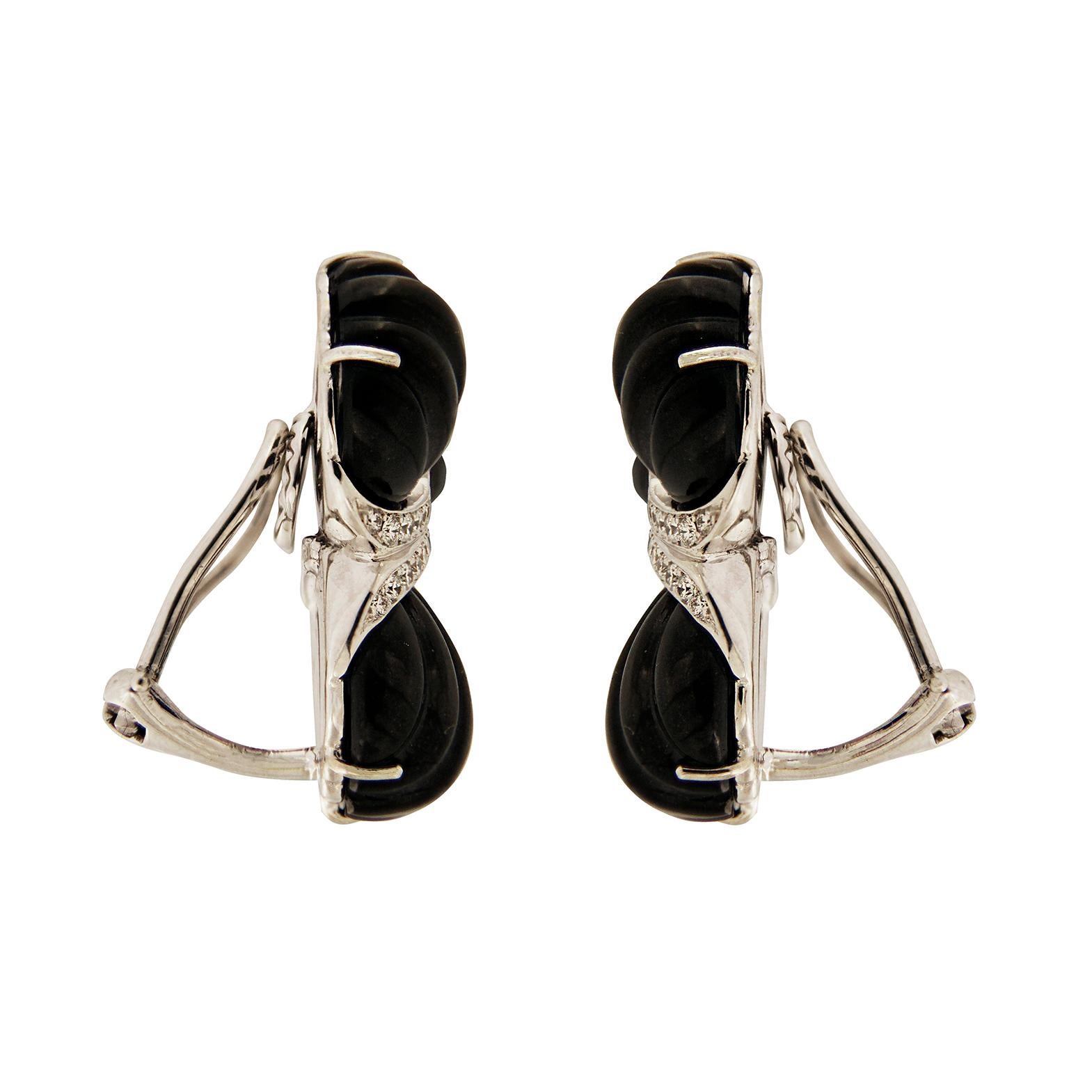 Valentin Magro Black Jade Diamond Triple Fan Earrings form a striking color combination. Black jade is carved into fluted fans. Their bottom edges adorned with white round brilliant cut diamonds. The jewels come together with diamonds in the middle