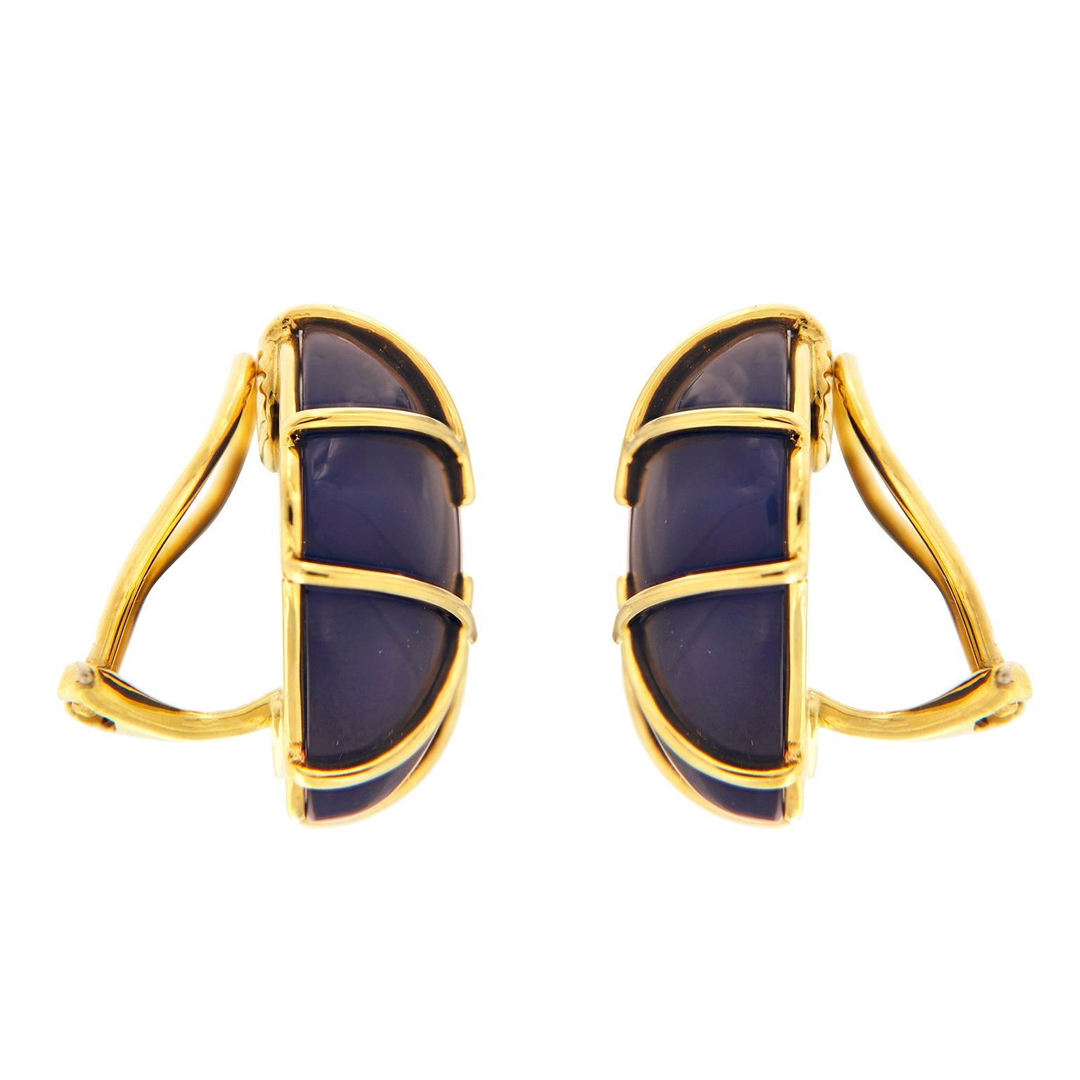 Gleaming blue agate is amplified by gold. A cushion-shaped cabochon of the gem is the base. Sleek 18k yellow gold bars overlap in a tic-tac-toe pattern, while also giving the illusion of an accent cornered square in the center. The total weight of