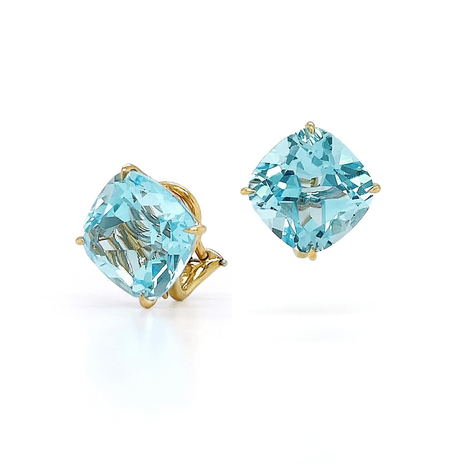 Glistering aqua hues are the focus of these blue topaz earrings. Carved into a classic cushion cut, sparkling dispersion emits from the blue topaz. The gem is turned on its side as a rhombus and secured by 18k yellow-gold claws for a contemporary