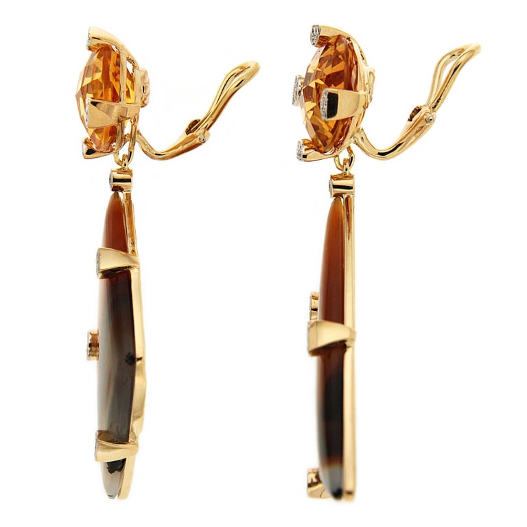 Valentin Magro Checkerboard Citrine Montana Agate Drop Earrings show off the beauty of orange. Their uppers consist of round citrines with checkerboard faceting. Below hang triangular Montana agate striped with wavy orange and edged in white. Round