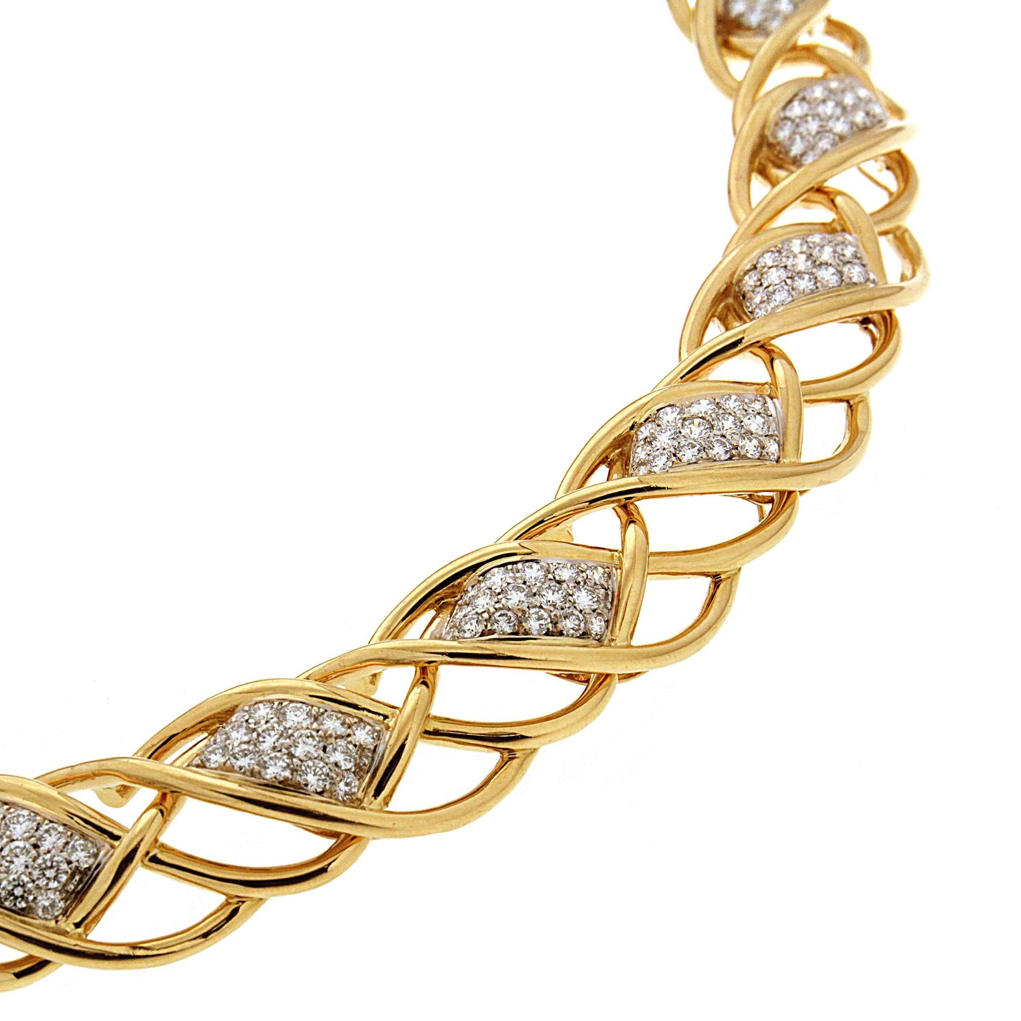 Valentin Magro Curvy Twisted Gold Line Necklace with Diamond Pave Motifs appears to hold a jeweled ribbon. The body is made of 18k yellow gold wires twisted around one another to make a united whole. Pave set round brilliant cut diamonds form eleven