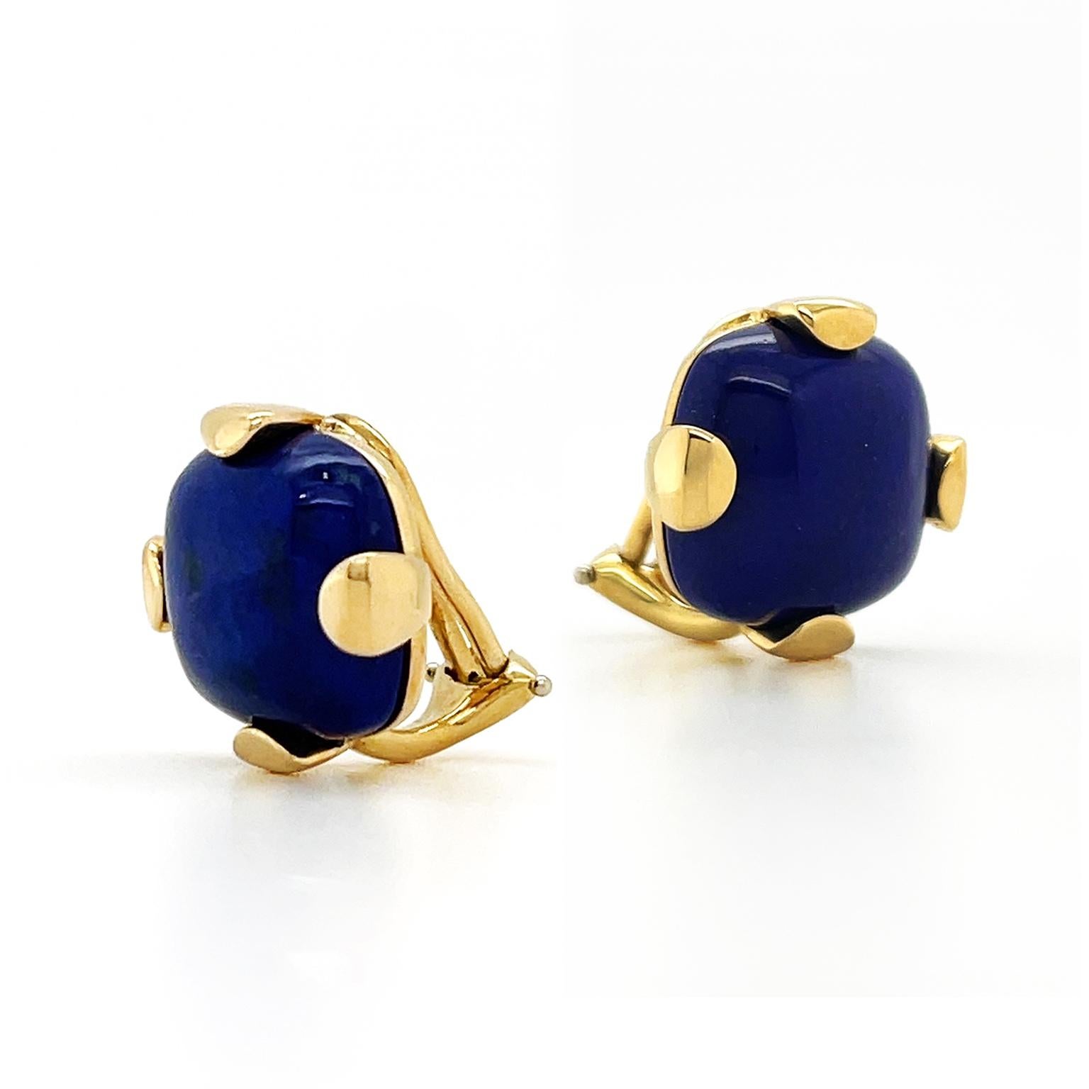 The regal pairing of blue-violet and gold is the focus of these earrings. Lapis lazuli is carved into a raised cushion cut, heightening its deep hue. Rounded 18k yellow gold prongs wrap around each side of the gem while underlining the gold