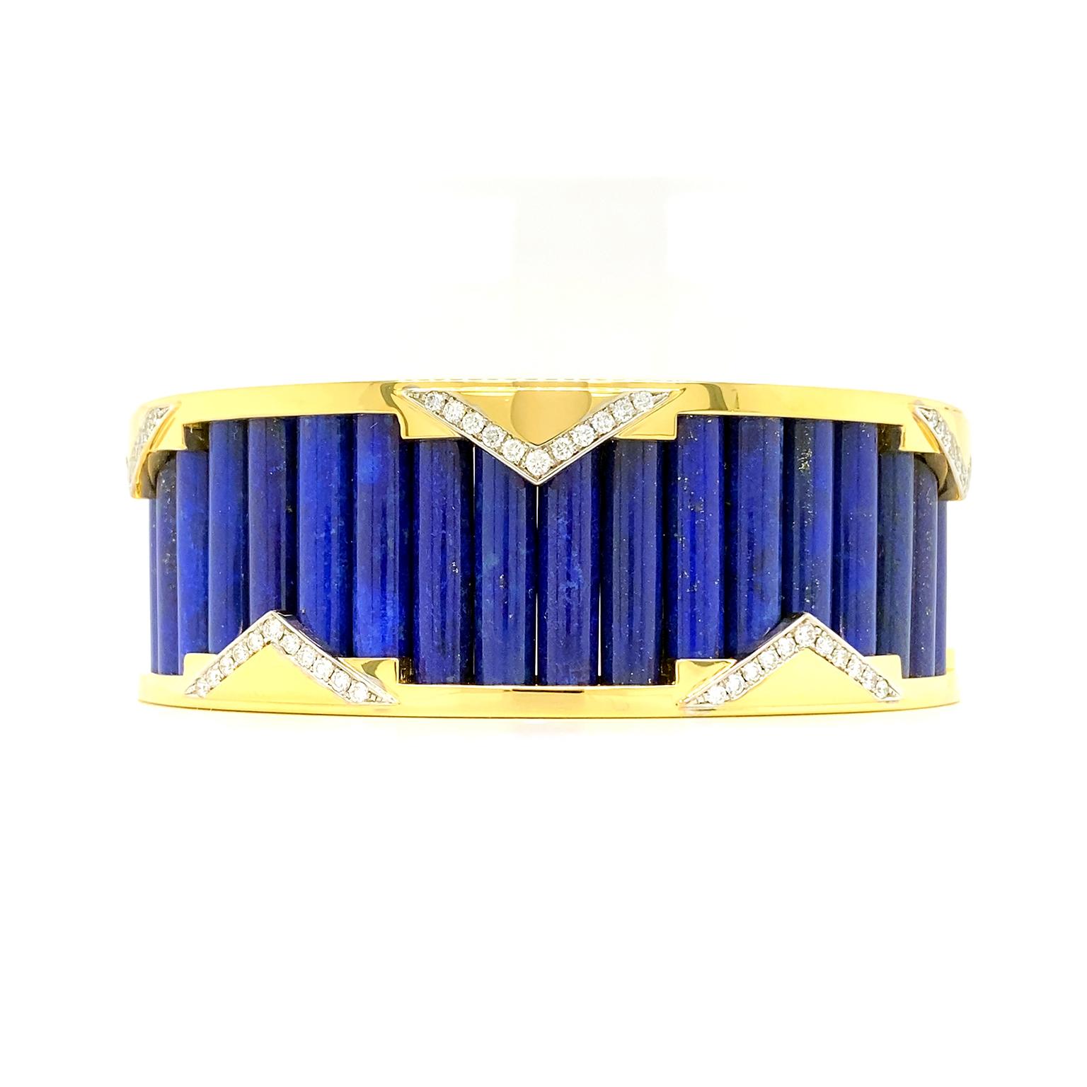 Influenced by the splendor motifs of classic Art Deco, this bracelet features an 18k yellow gold cuff with triangular accents. A row of brilliant cut diamonds produces a radiant glow while tracing the edges of each geometric pattern. The cuff frames