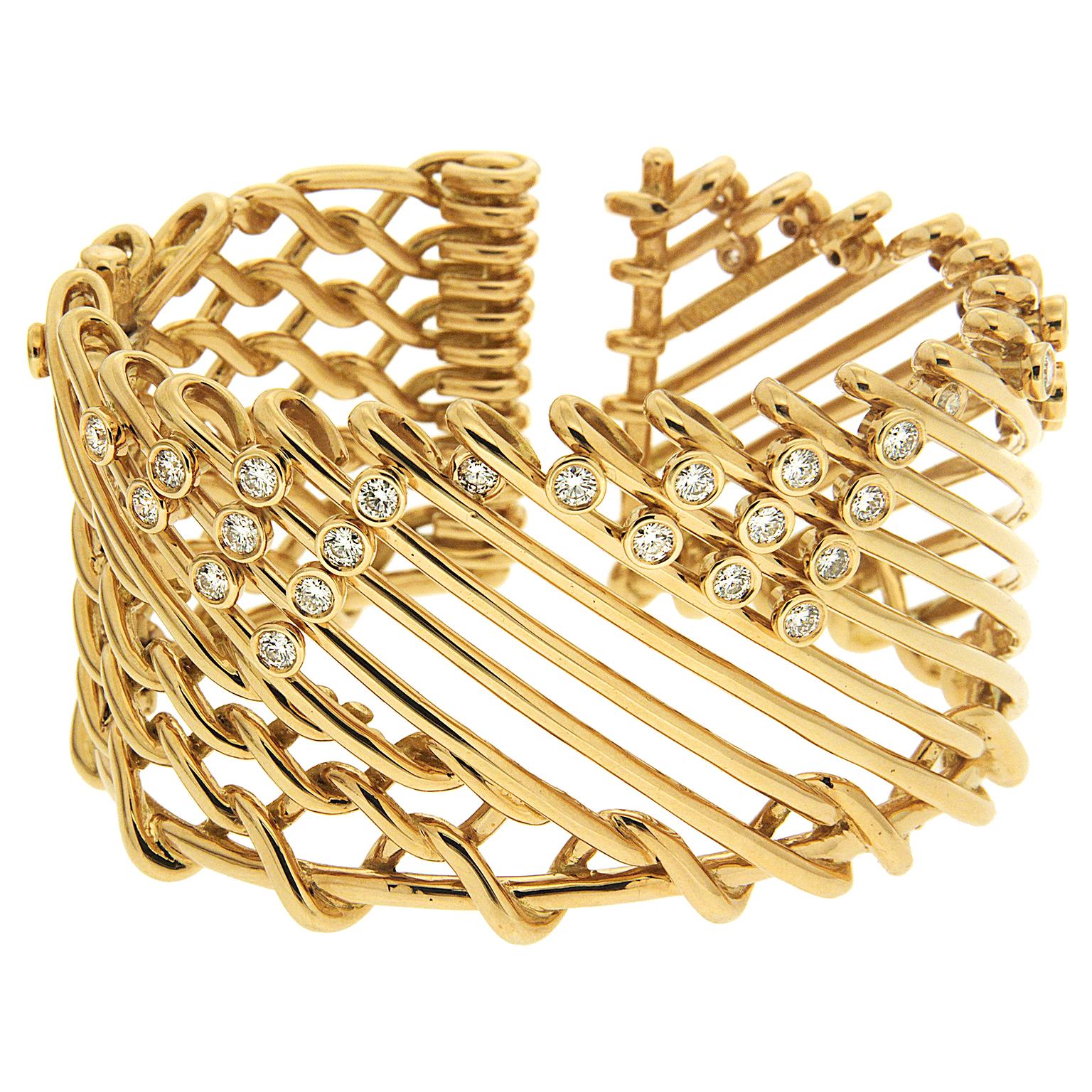 Valentin Magro Diamond Gold Triangular Motif Netting Bracelet showcases different forms of openwork. Some of its 18k yellow gold interlocks with one another, forming links. The rest of the bracelet showcases diagonal gold strips. Bezel set round
