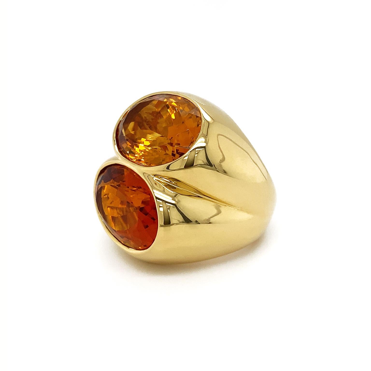 Valentin Magro Double Oval Citrine Ring transforms gems into a study in gold. One of the gems is a deep red-orange Madeira citrine, named after the wine’s hue. The other is on the yellower end of orange. Both are fashioned into ovals and bezel set