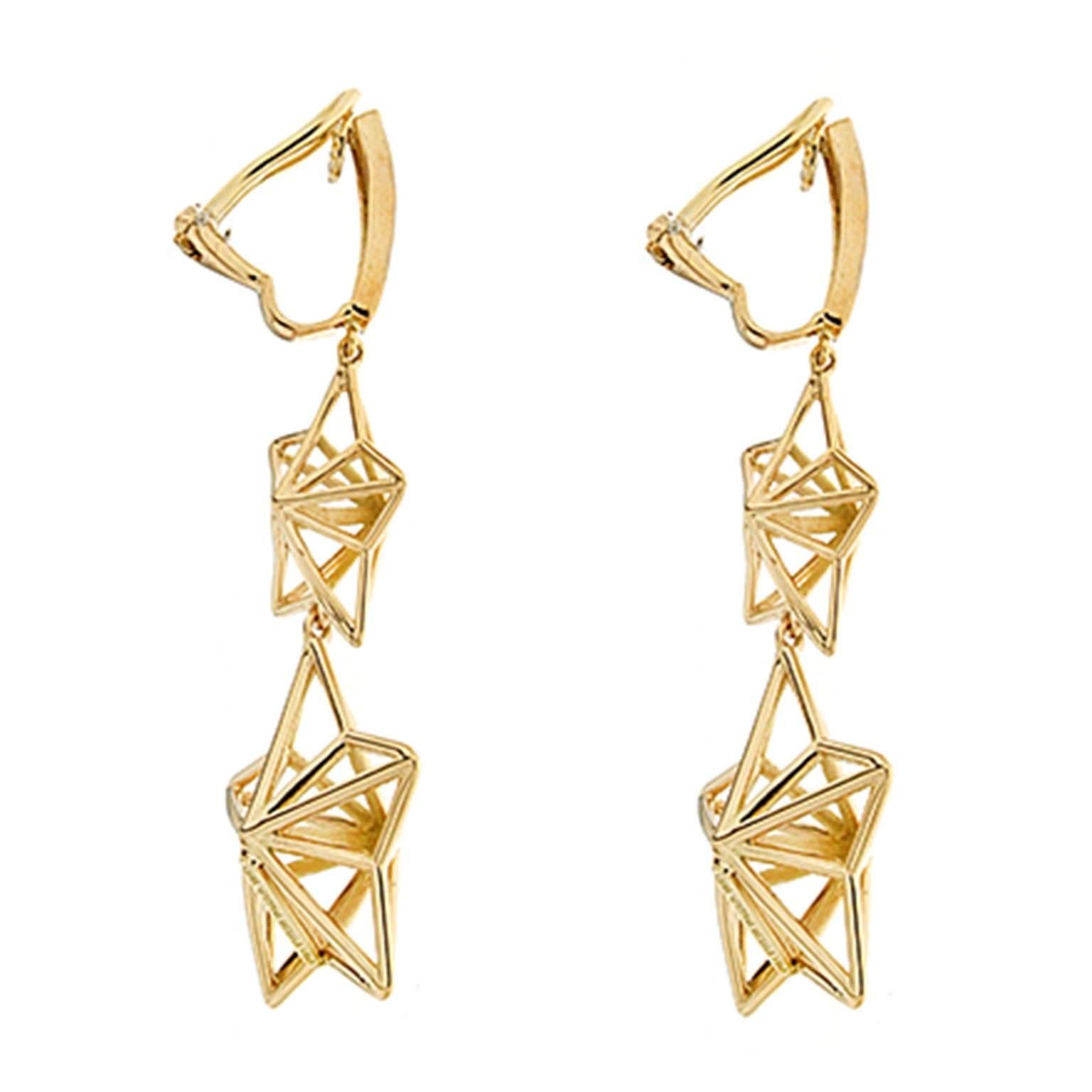 Valentin Magro Yellow Gold Diamond Star Dangling Earrings combine complex shapes with whimsical design. A series of 18k yellow gold bars radiant from a single hub. They join with more gold to form triangles, then rhombuses and finally