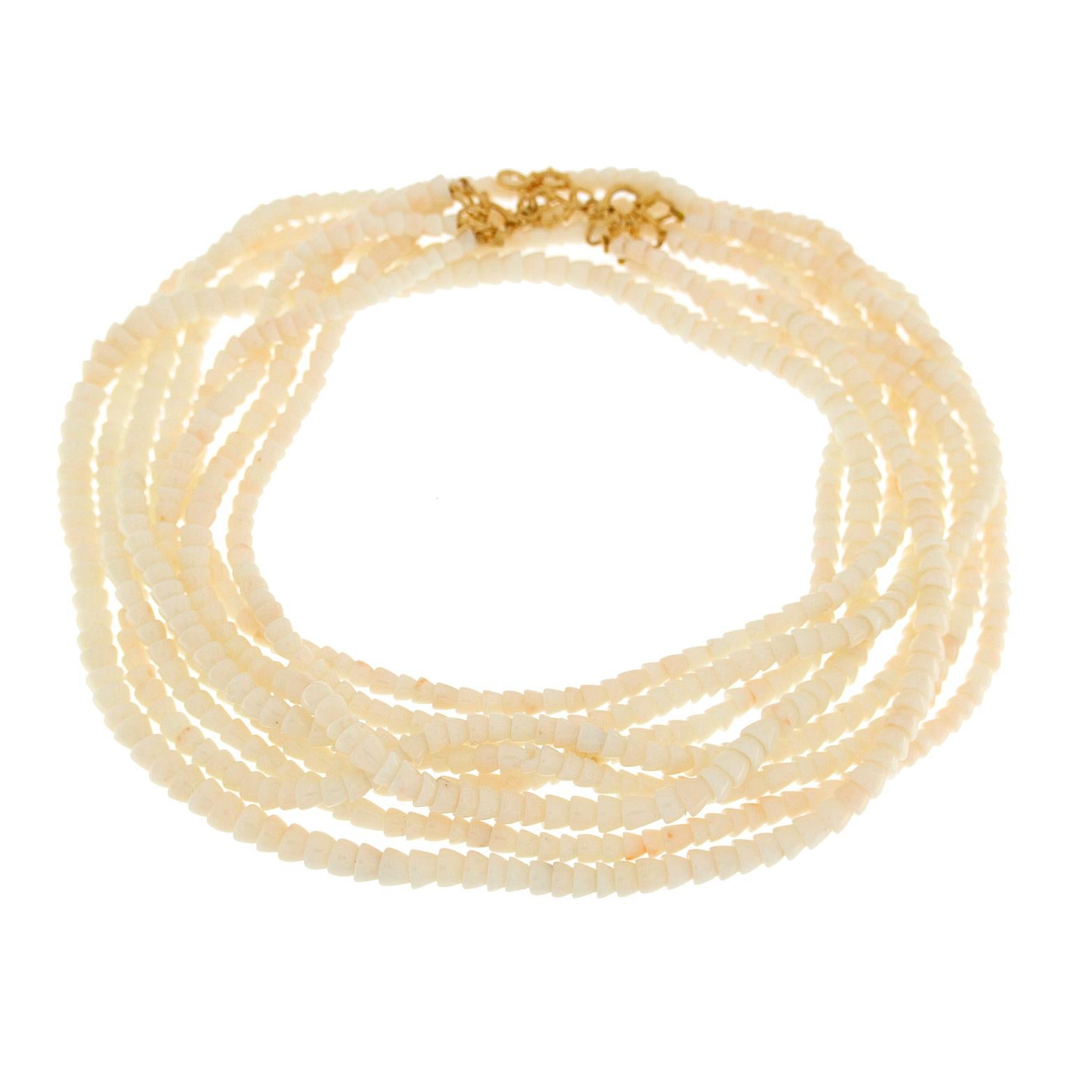 Valentin Magro Four-Strand White Coral Cone Necklace showcases an abundance of beads. Recycled white coral with subtle color variation is the gem of choice, carved into countless cones. The pieces are strung into four rows, connected at the ends