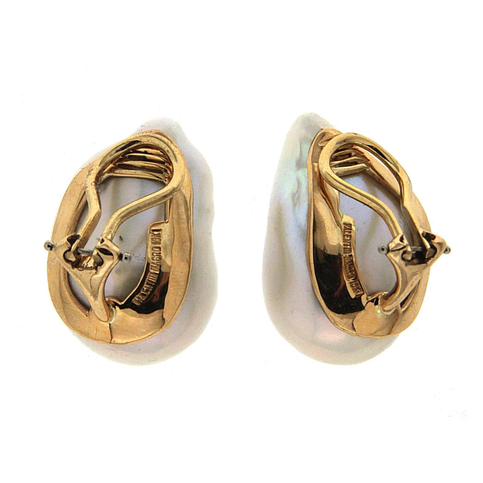 Baroque pearls are the centerpiece of these earrings from Valentin Magro. Their irregular shapes allow light to reflect from many angles, showing off their iridescence. The reverse of each earring is made of 18k yellow gold, including the