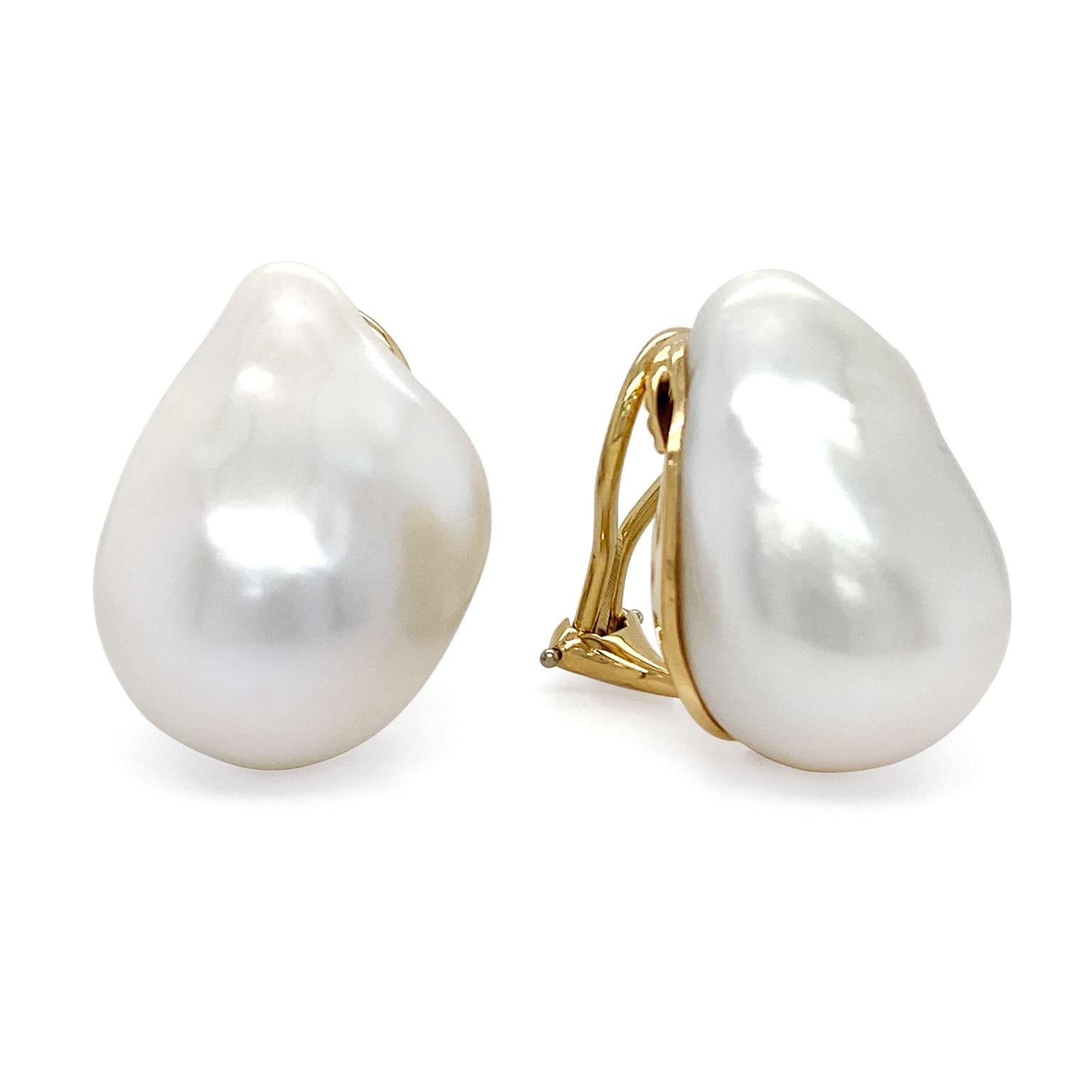 The unique beauty of the freshwater pearl is spotlighted as the exclusive gem in these earrings. As the light falls upon the various rifts, a special luster is given. Clip-backs secure the earrings, which contain 88.26 carats of pearls and measure