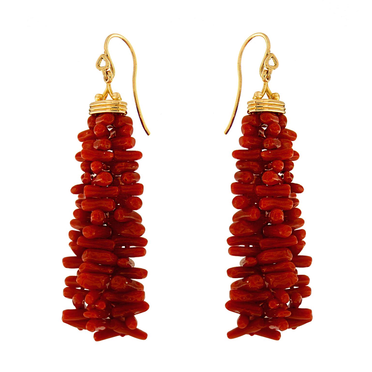 This unique pair of earrings features 18kt yellow gold signature Crown Cap with 3 strands of Sardinian Coral tassels and french hook.