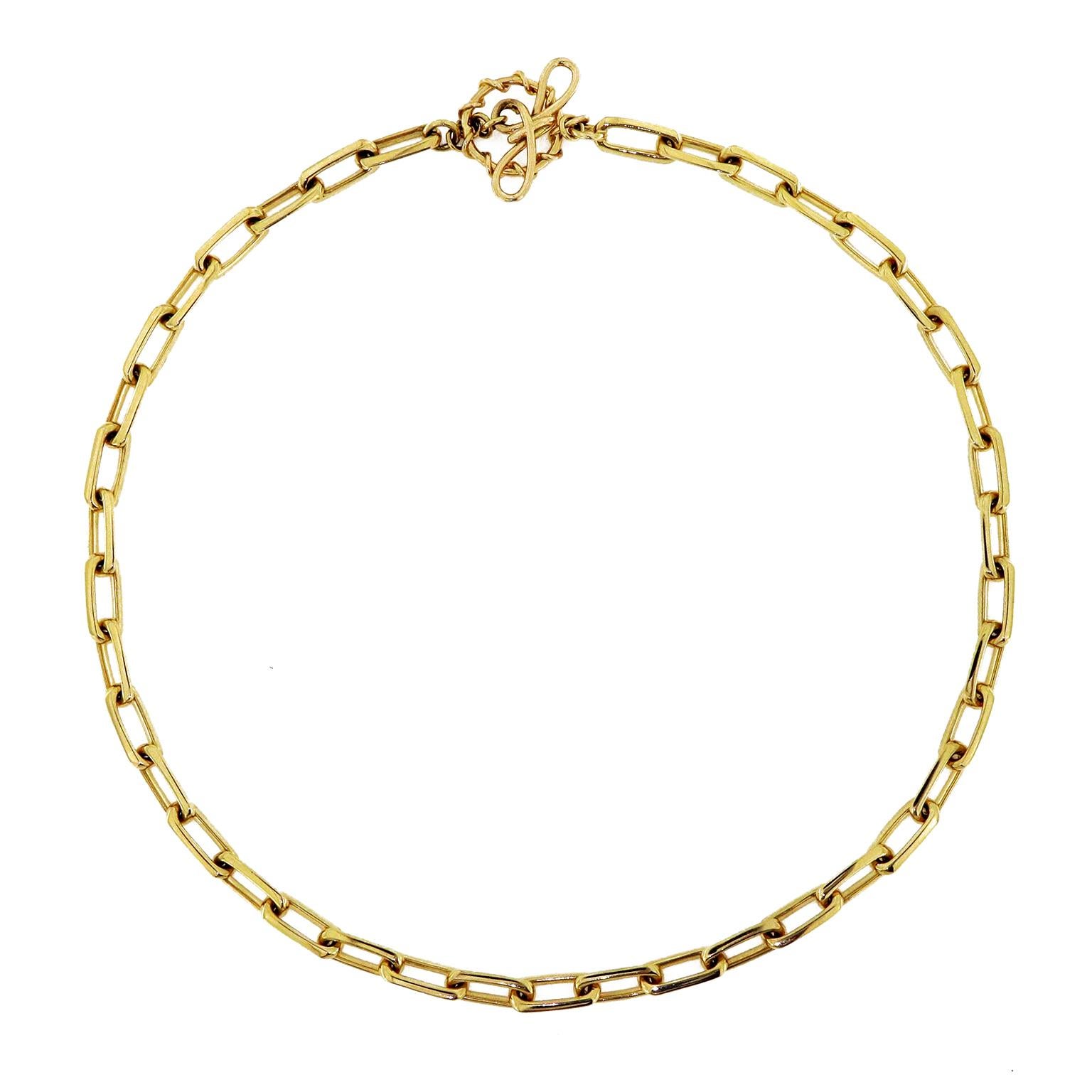 18k yellow gold links creates an elegant radiance for this necklace, which is secured with a knot and toggle clasp. The necklace measures 17.13 inches (length) by .24 inches (width).