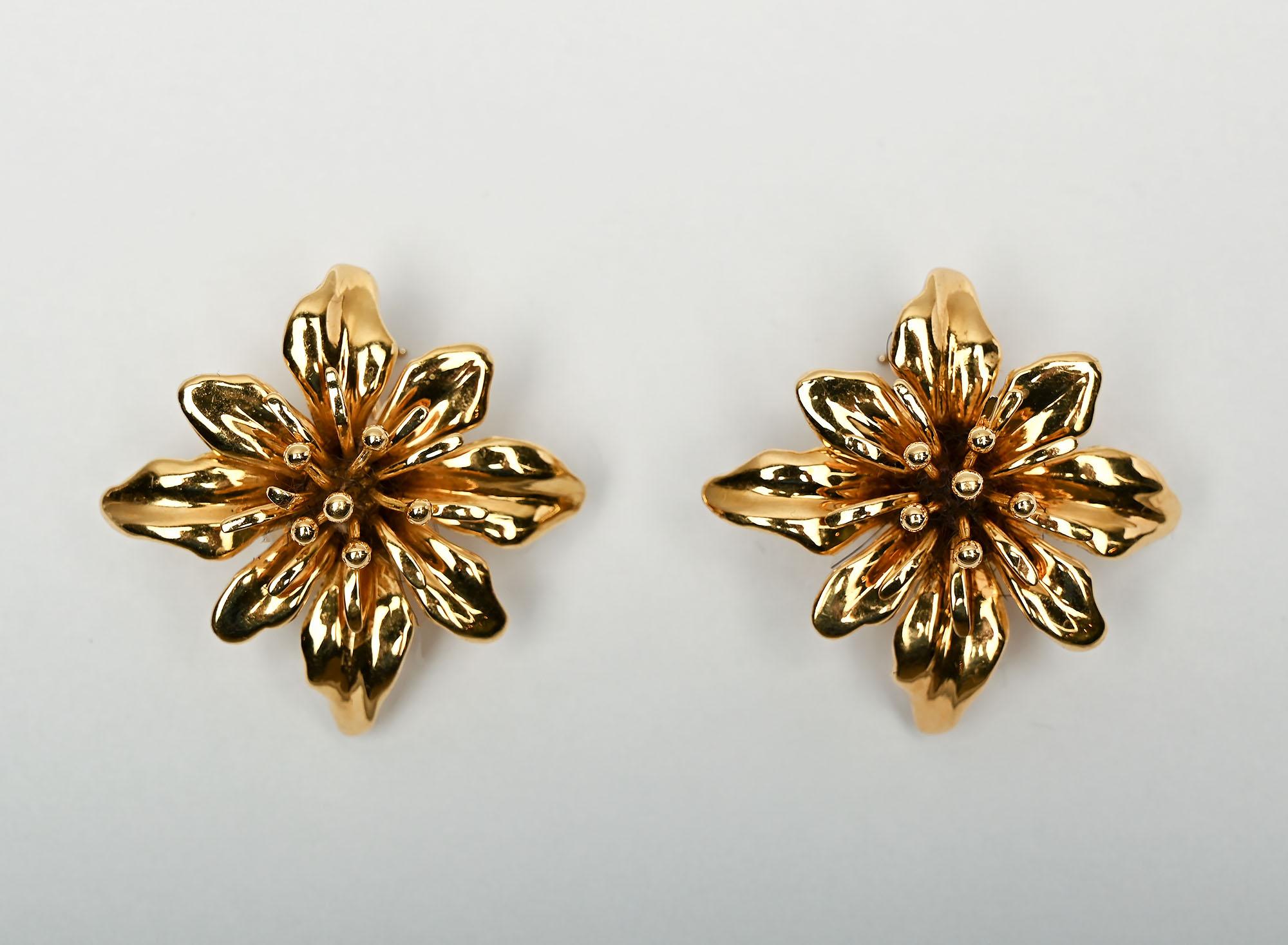 Valentin Magro is known for the fine detailing of his work and these earrings are no exception. There are two layers of petals and a cluster of pistils in the center. The earrings have a lovely sculptural form. They measure 1 5/16
