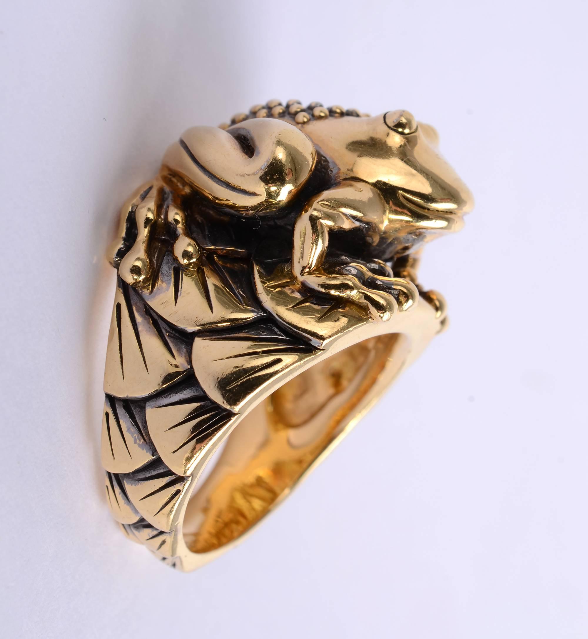 This charming, whimsical Frog Ring would serve well for anyone seeking his or her prince. The frog's back is beautifully textured with tiny balls. It is sitting on lily pads that continue throughout the band. The ring is size 8 1/2. It can be sized