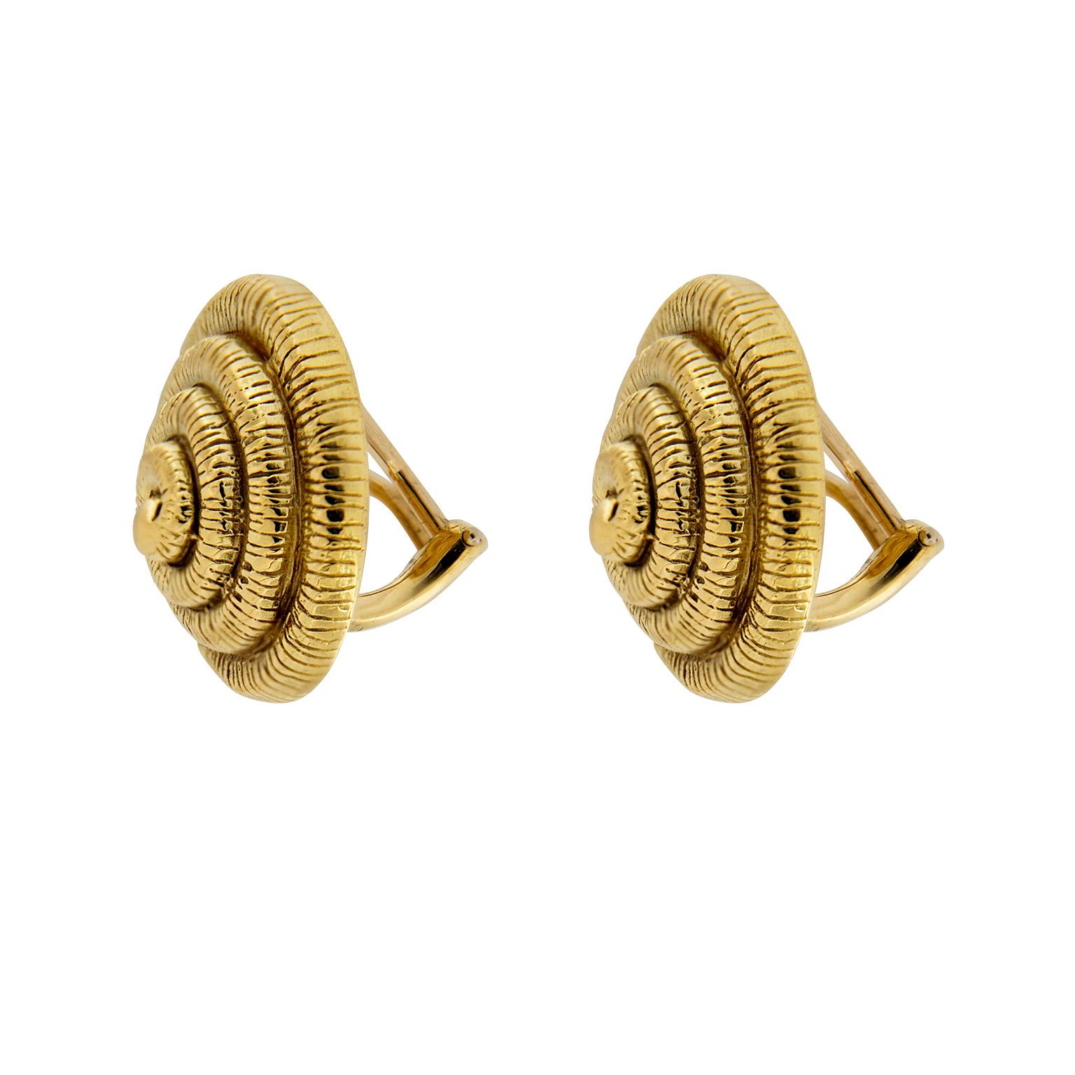 Valentin Magro 18 Karat Yellow Gold Nautilus Shell Earrings are coil inspired. The design starts as an 18k yellow gold knob, polished smooth. From here a spiral emerges, covered in fine parallel grooves. This whorl creates the shell imagery.