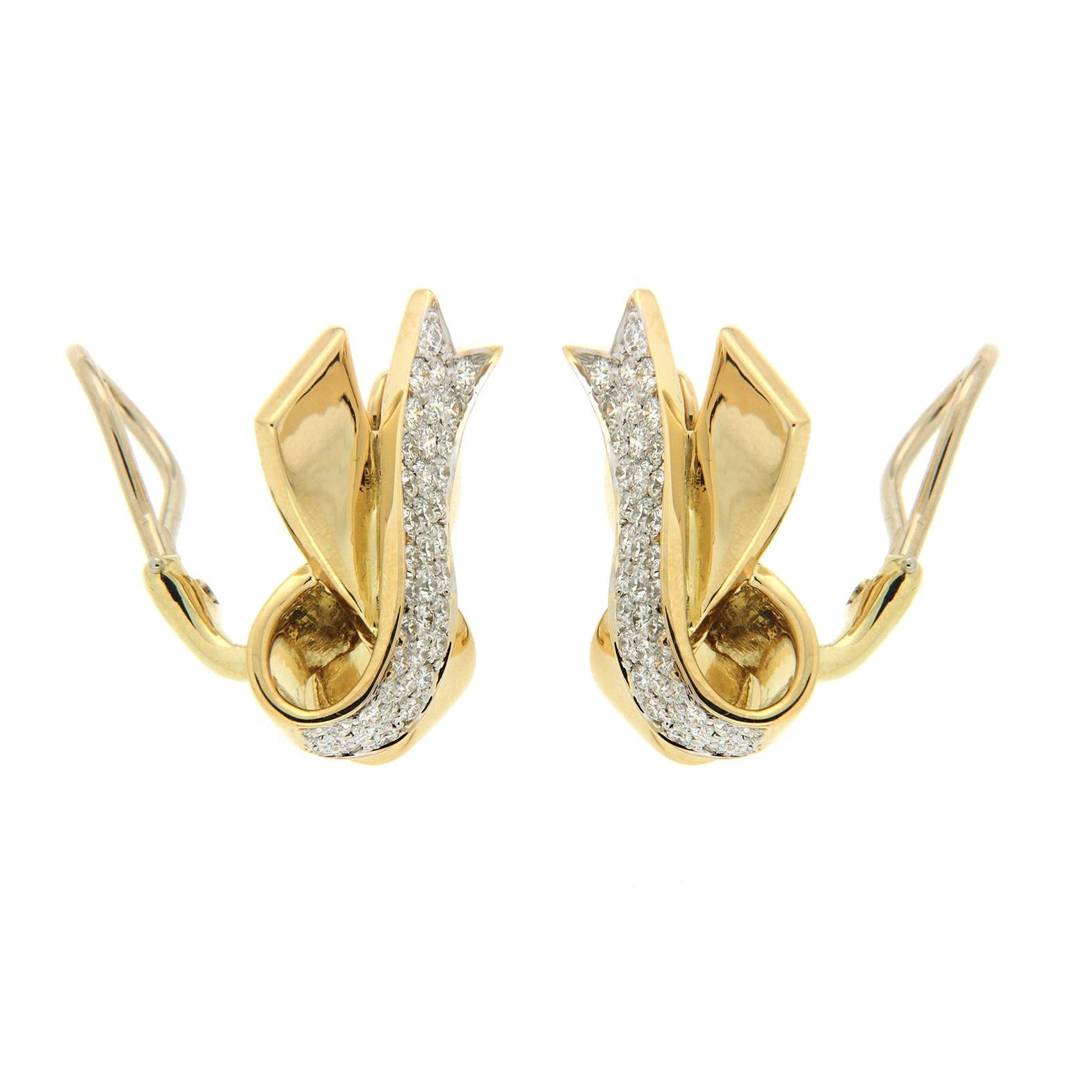 Valentin Magro Yellow Gold Pave Diamond Ribbon Earrings exhibit a playful note. Each earring has polished 18k yellow gold shaped into two ribbons that cross and fold over one another. The front most ribbons are encrusted in pave set round brilliant