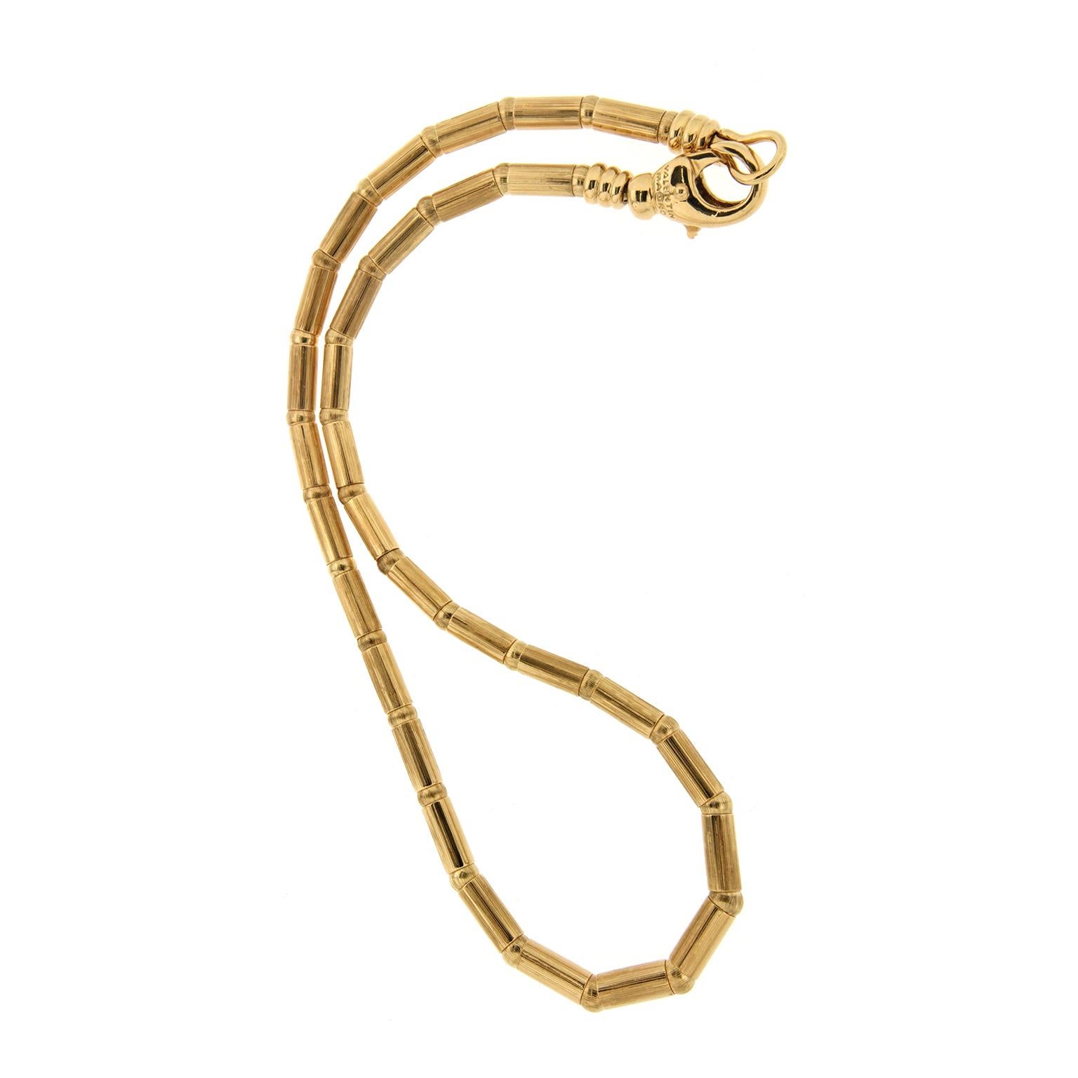 This understated necklace created by Valentin Magro consists of alternating tubes and balls. The design showcases the shaping possibilities of precious metal. 18k yellow gold makes up the entire piece. It hooks in back with a large lobster clasp.