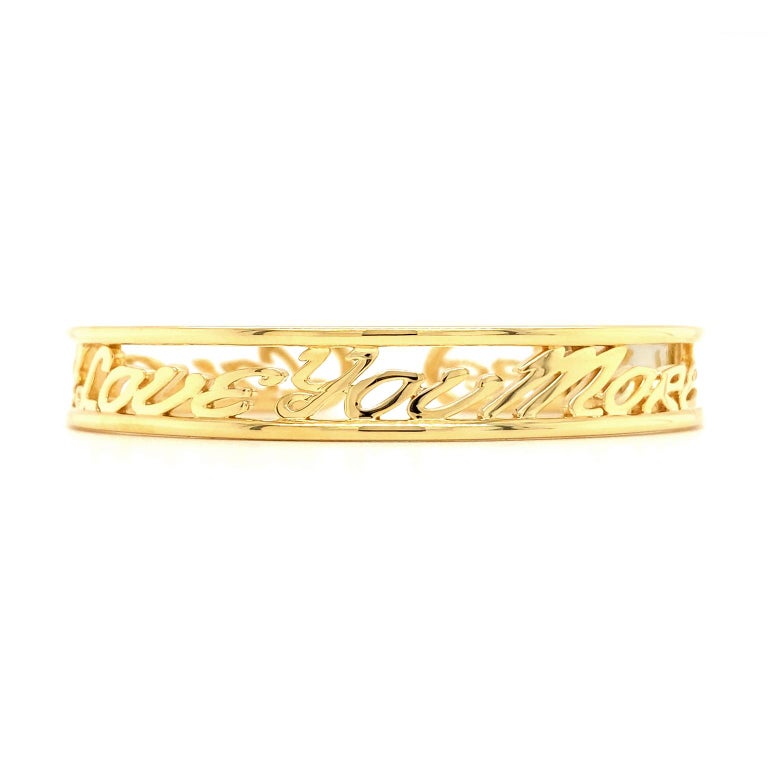 Valentin Magro I Love You More Classic Hinged Diamond Yellow Gold Wide Bracelet, is all the brighter courtesy of stars. The perimeter is made of round 18k yellow gold wire. The affirmation 'I love you more' is written over and over along the center.