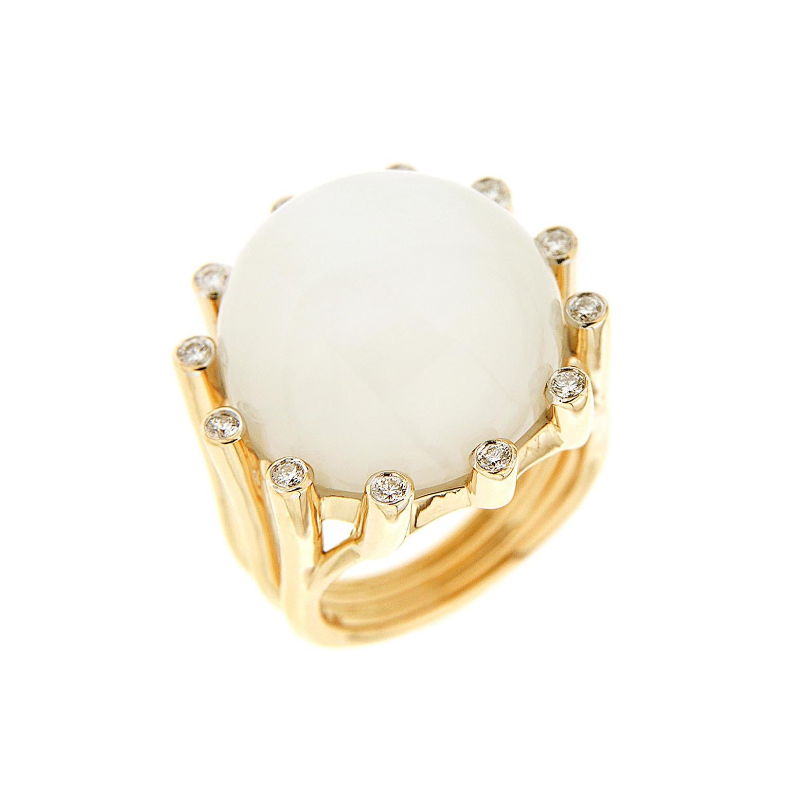 Valentin Magro La Luna Moonstone Gold Ring brings together sun and moon. The center gem is a white moonstone, carved into a round cabochon. This jewel is famed for ethereal light known as adularescence. Surrounding it are 18k yellow gold prongs