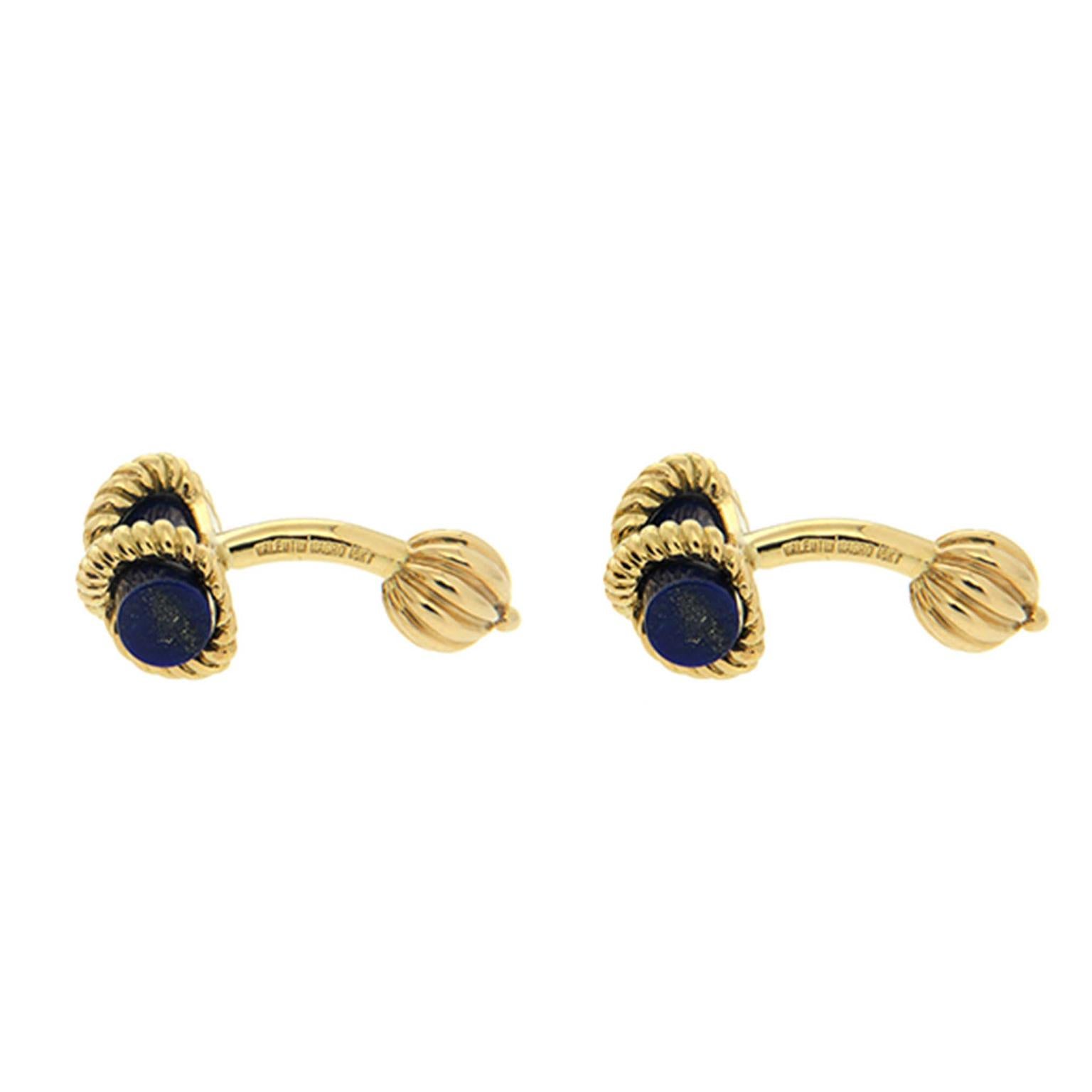 Lapis lazuli and gold make up these cufflinks. The fronts sport bars of deep blue lapis. A twisted 18k yellow gold rope crisscrosses the front. The reverse sides feature more gold, with a post and fluted ball to hold cuffs together.

Measurement