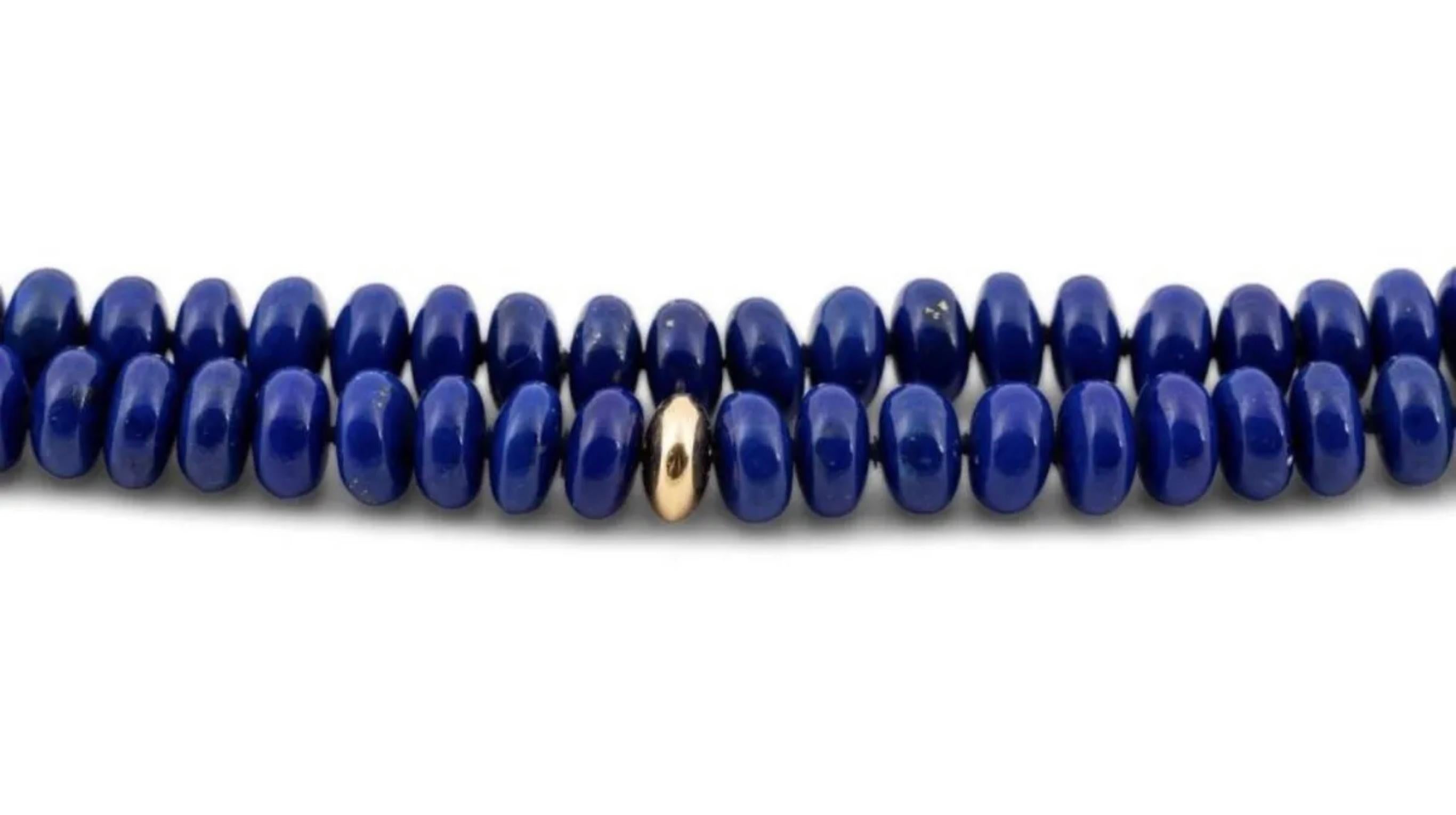 Valentin Magro double strand lapis lazuli and 18k bead 36” necklace featuring 8.1mm to 8.3mm rondelle beads in dark blue lapis strung with (10) gold rondelle shaped beads with an 18k gold decorative claspwith makers mark and marked 18k. Excellent