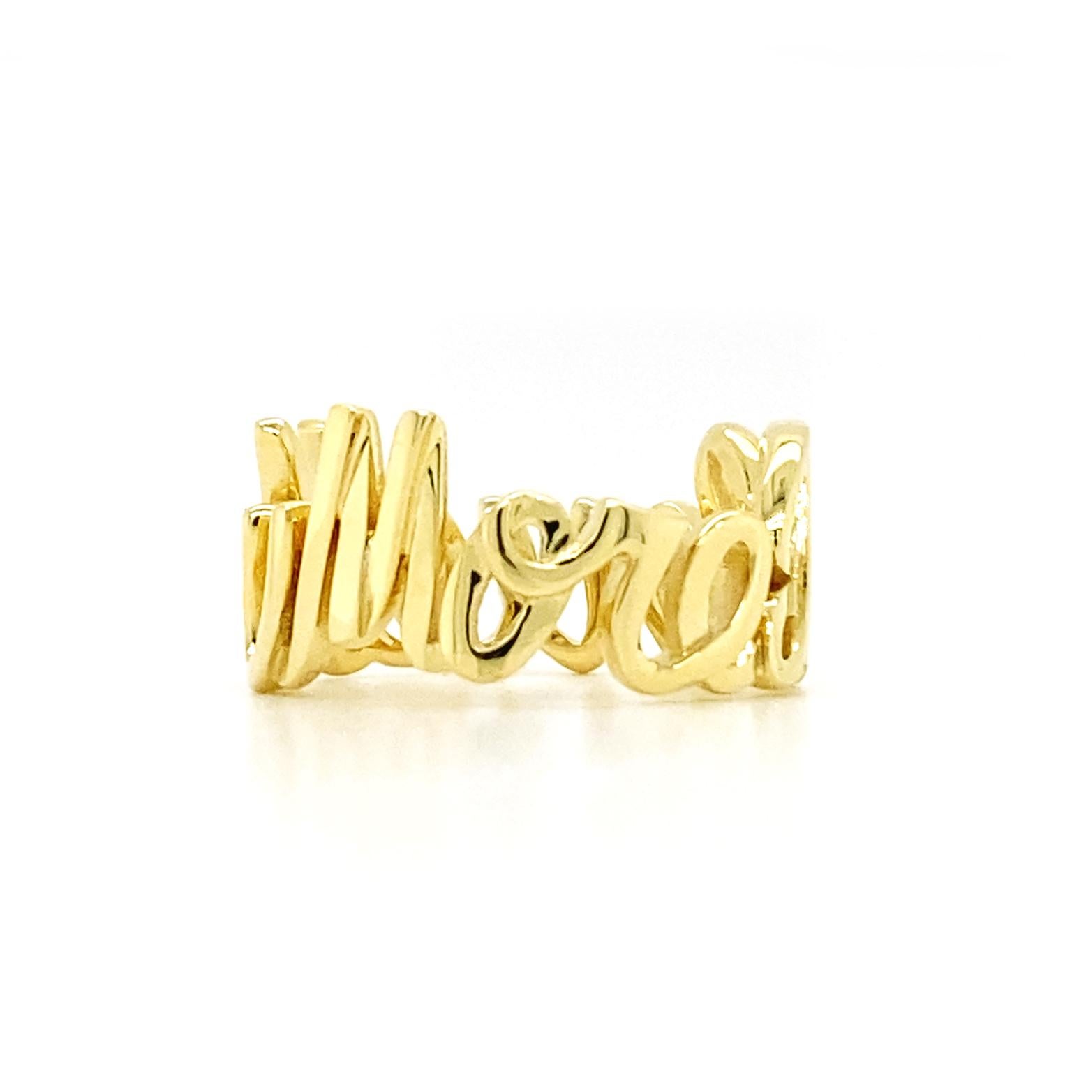 Vivid gold script bounds this ring. 18k yellow gold forms openwork cursive letters measuring 9.75mm tall to spell the message I Love You More. The romantic phrase rotates to form the polished band. Measurements for the ring are 0.82 inches (width)